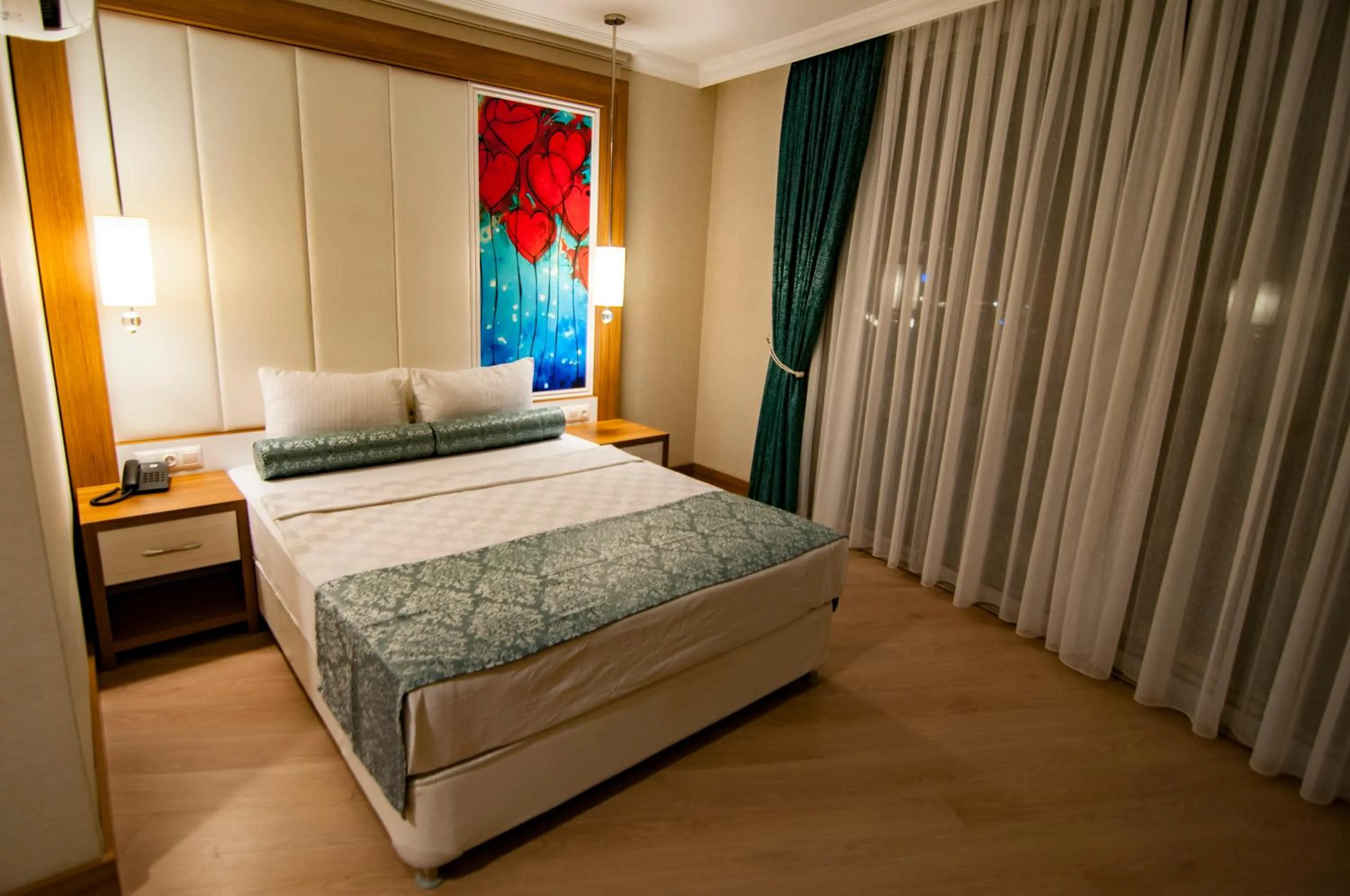 Bed in Exelans Hotel