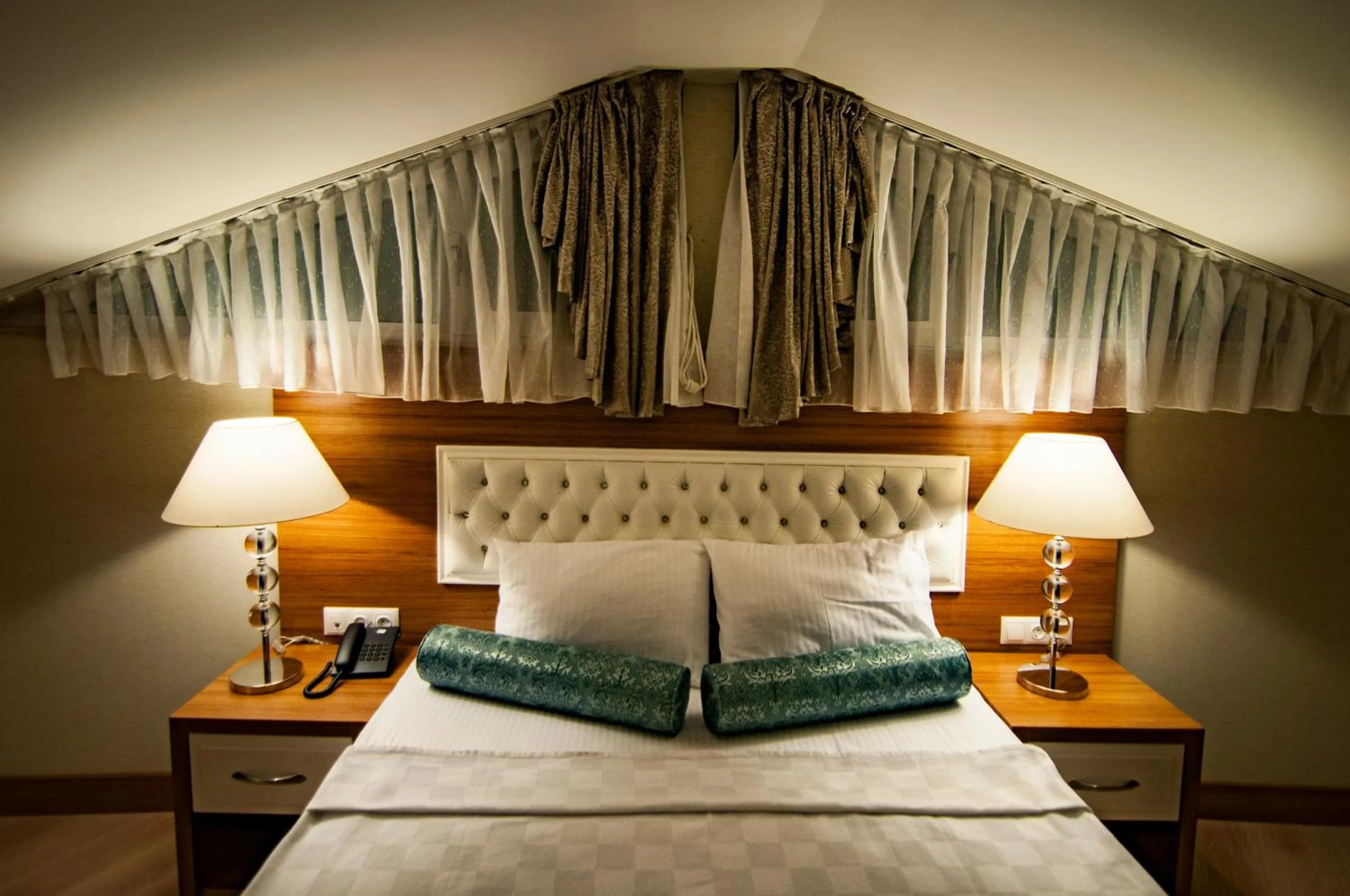 Bed in Exelans Hotel