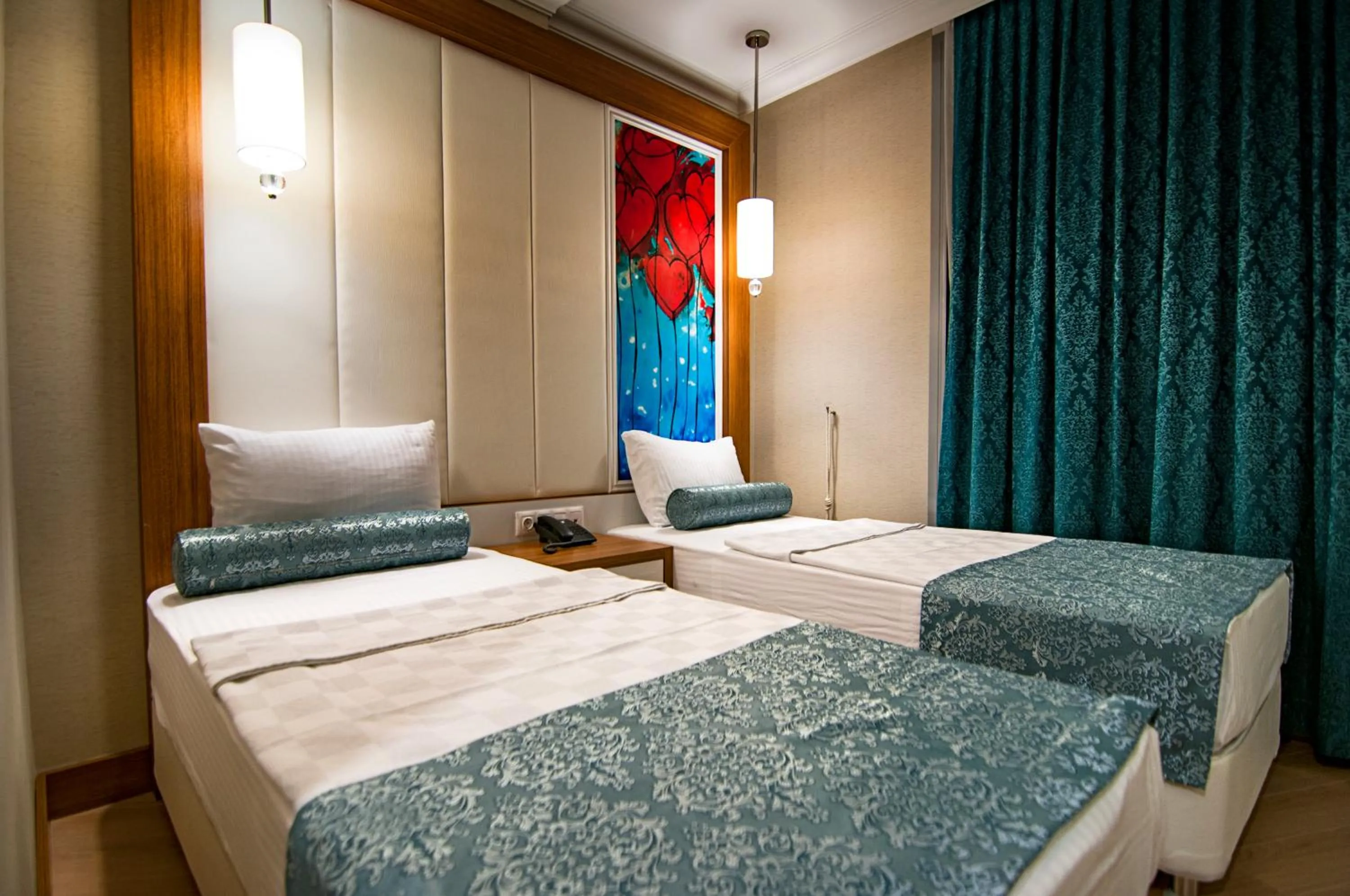 Bed in Exelans Hotel