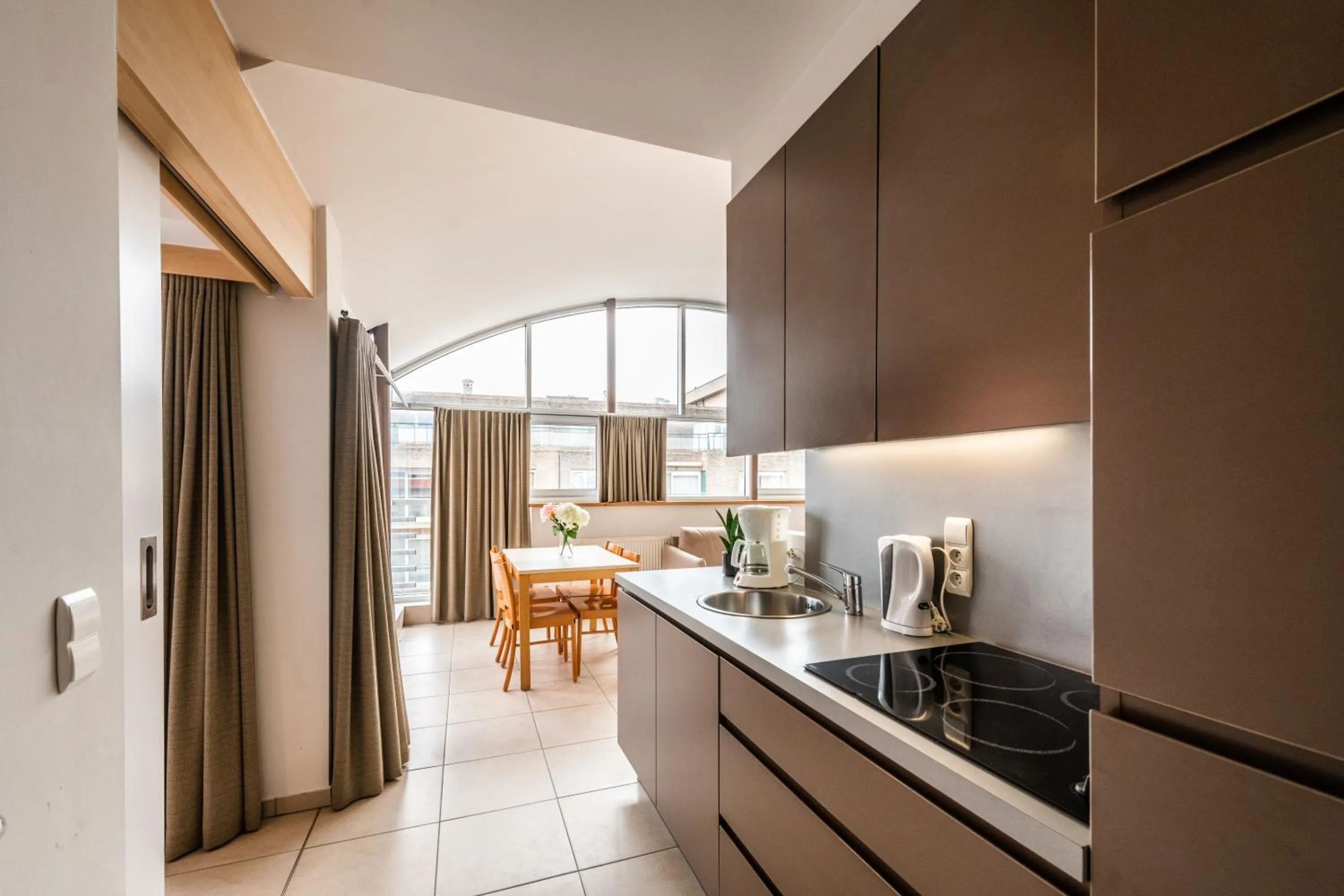 Kitchen or kitchenette in Belcasa Suitehotel
