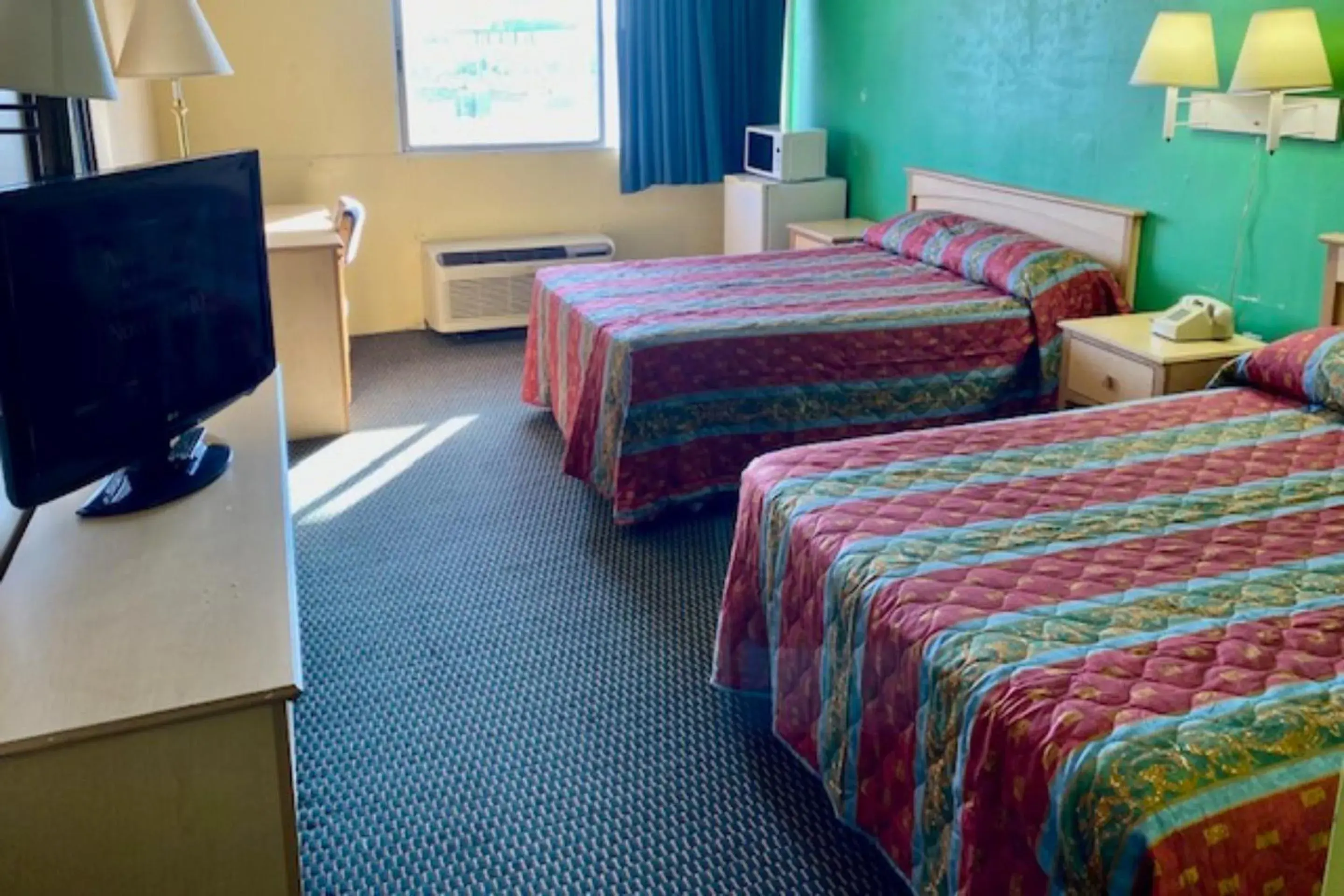 Bedroom, Bed in Red Carpet Inn & Suites Lima -Listing Partner Bedroom, Bed in Red Carpet Inn & Suites Lima -Listing Partner