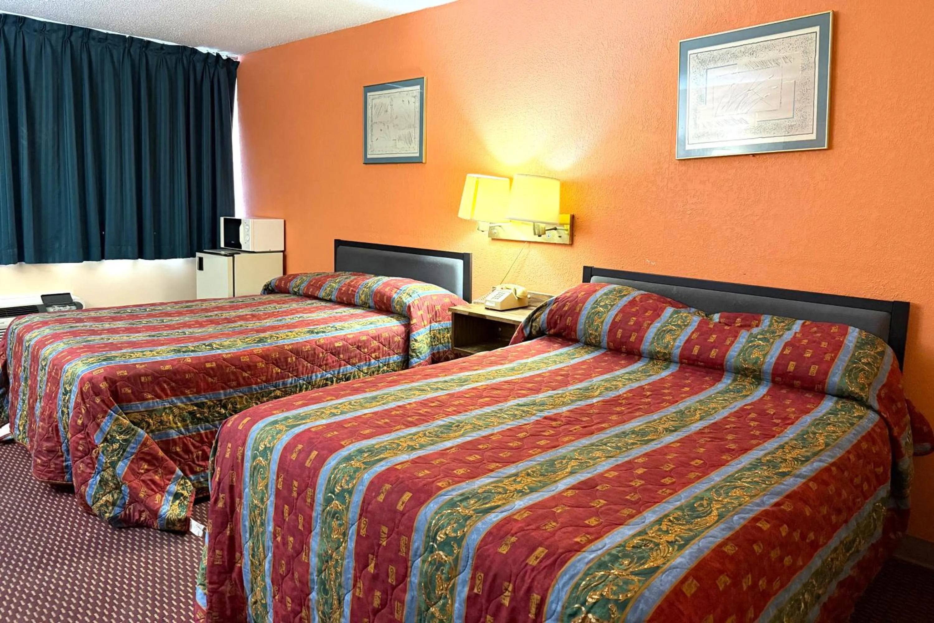 Bedroom, Bed in Red Carpet Inn & Suites Lima -Listing Partner