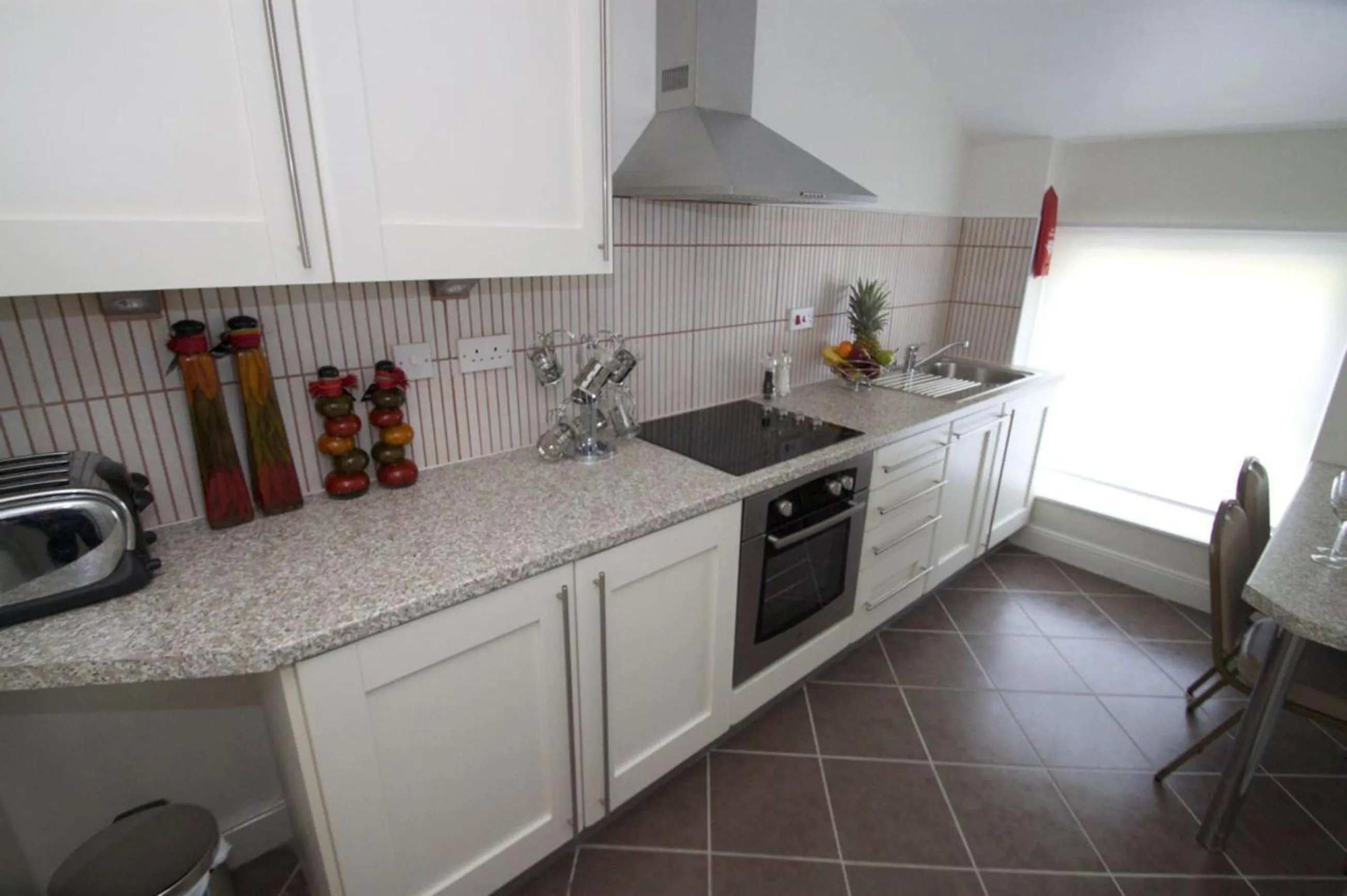 Kitchen or kitchenette in La Suisse Serviced Apartments
