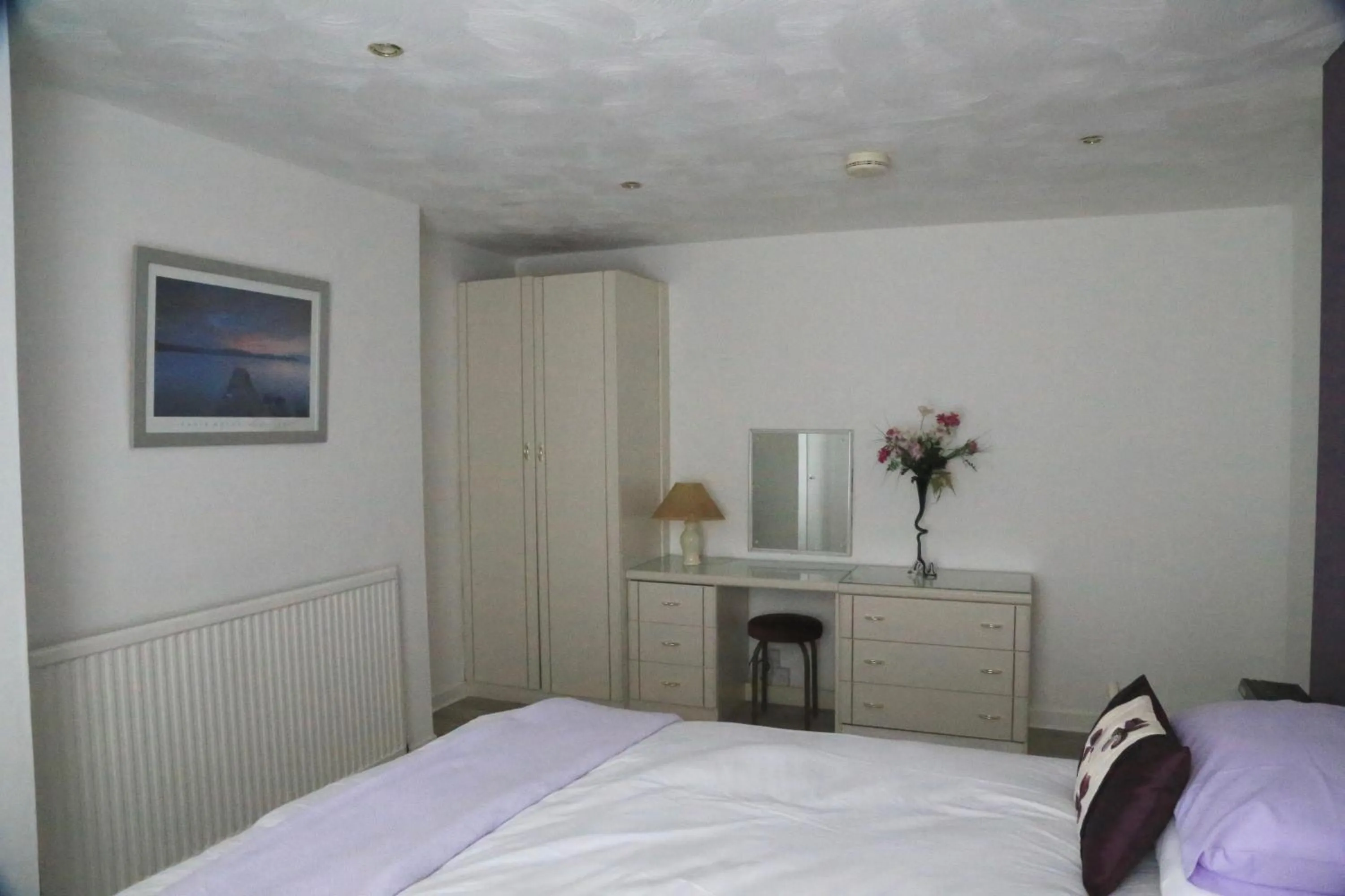 Bed in La Suisse Serviced Apartments