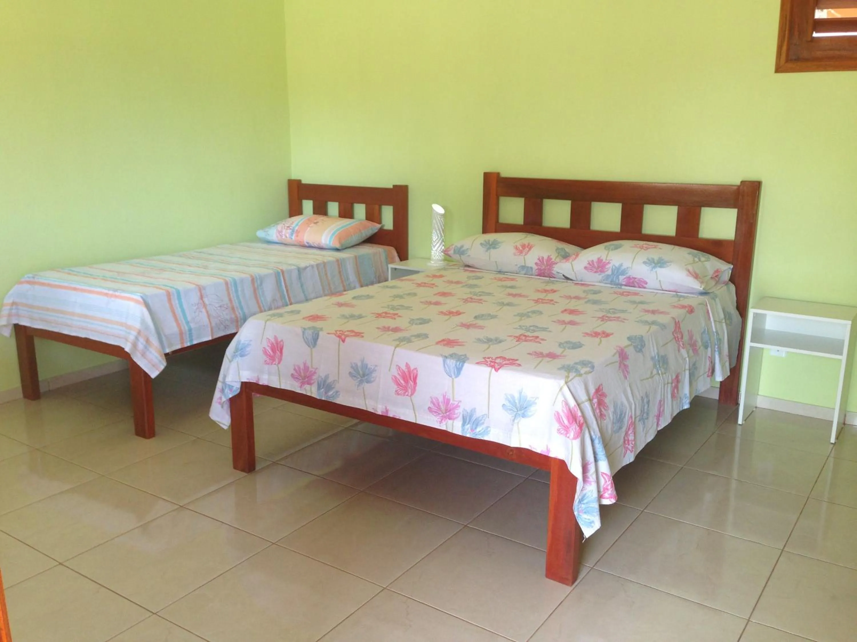 Bed in Pousada Muiraquitã