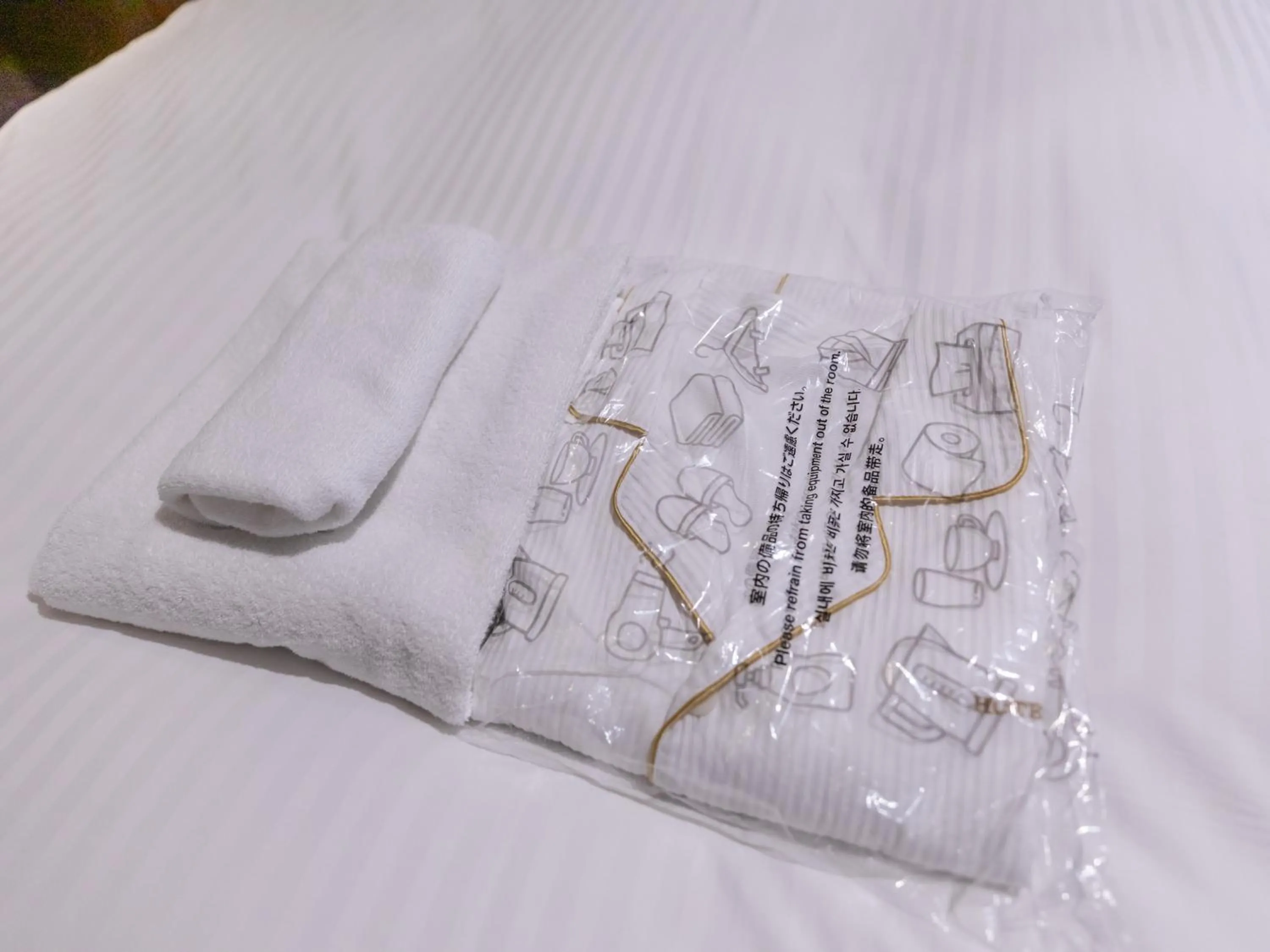 towels, Bed in Hotel Excellence Enmachi Ekimae
