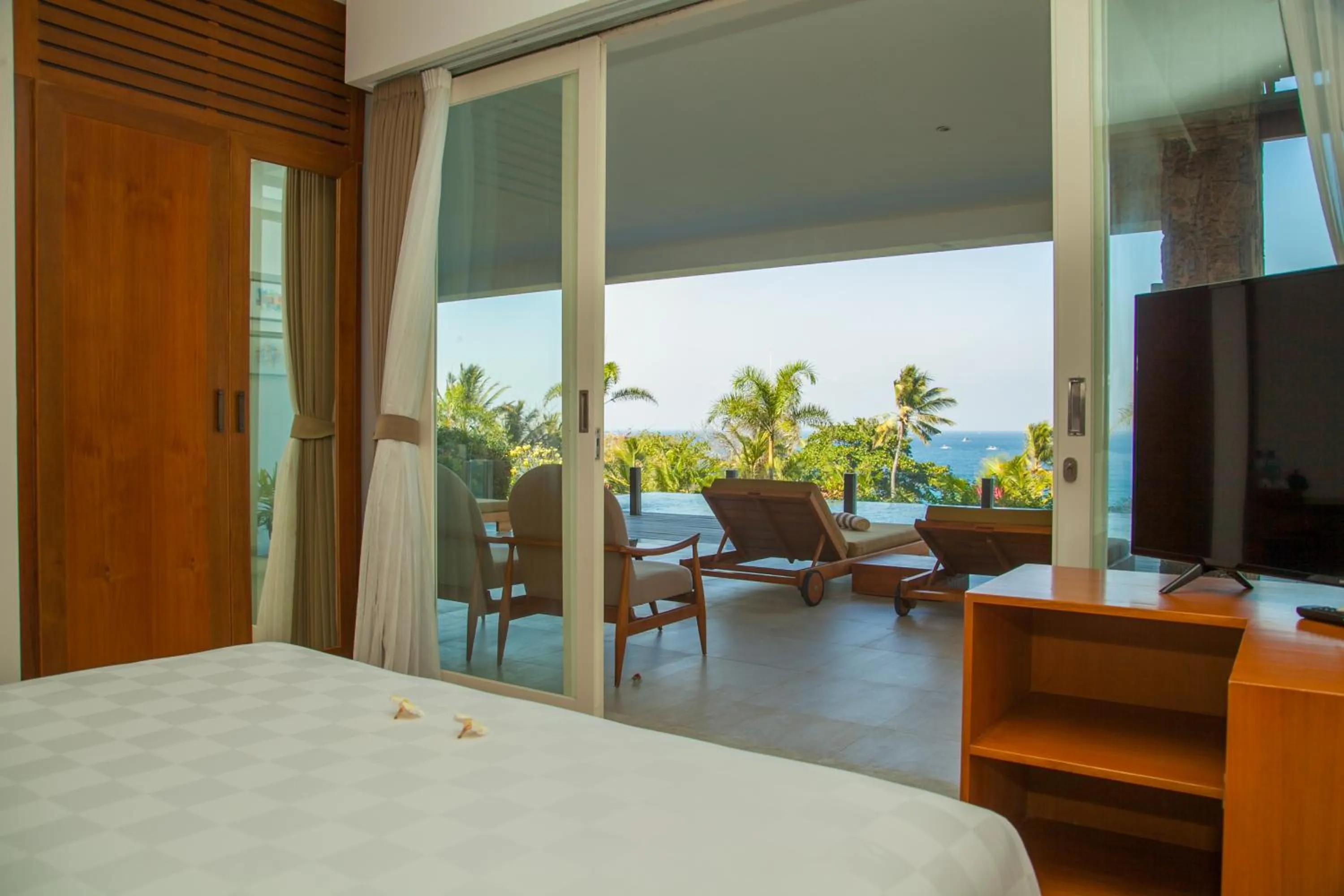 Patio, Bed in Rajavilla Lombok Resort - Seaside Serenity