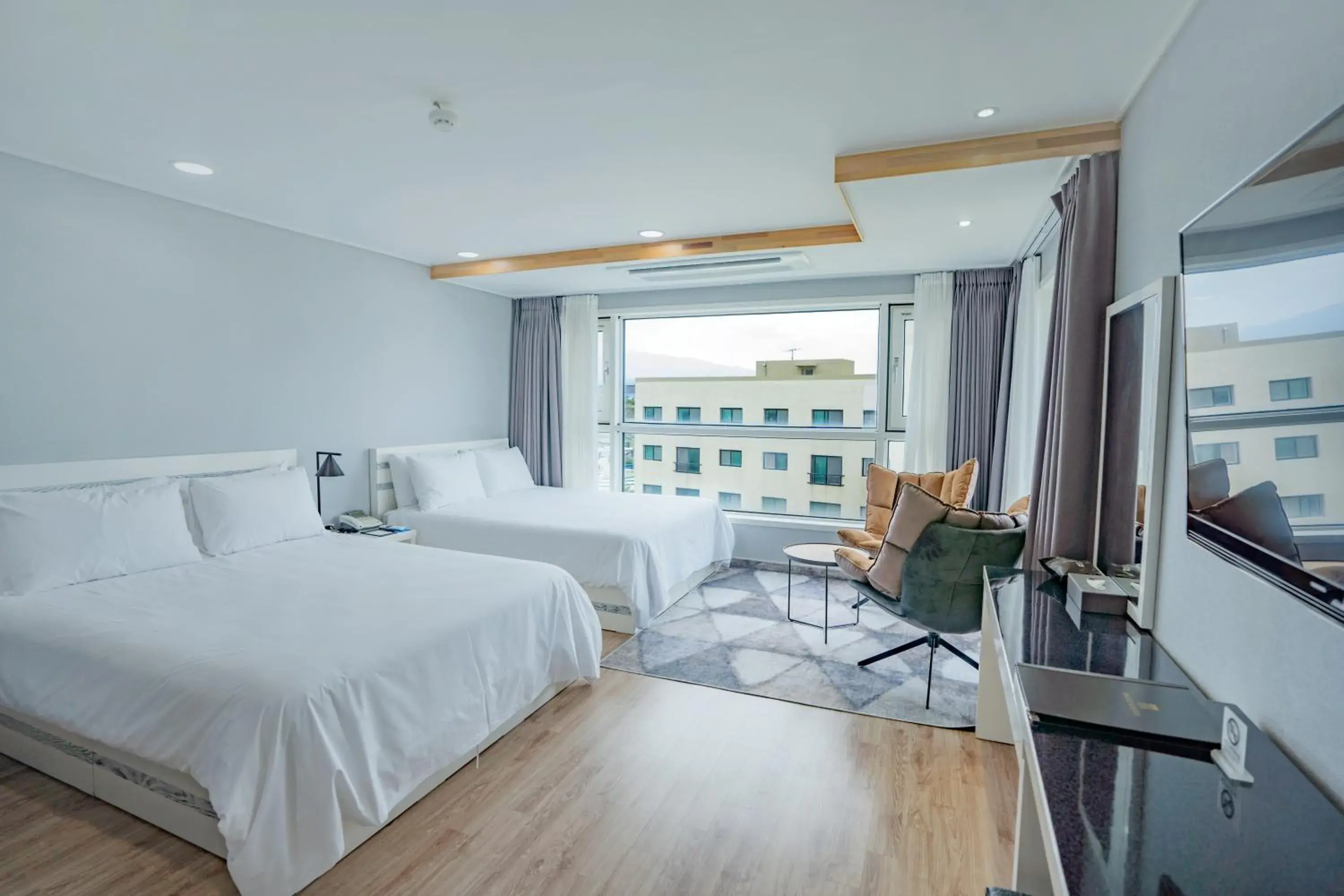 Photo of the whole room, Bed in Hotel Sweet Castle Jeju Hamdeok Photo of the whole room, Bed in Hotel Sweet Castle Jeju Hamdeok