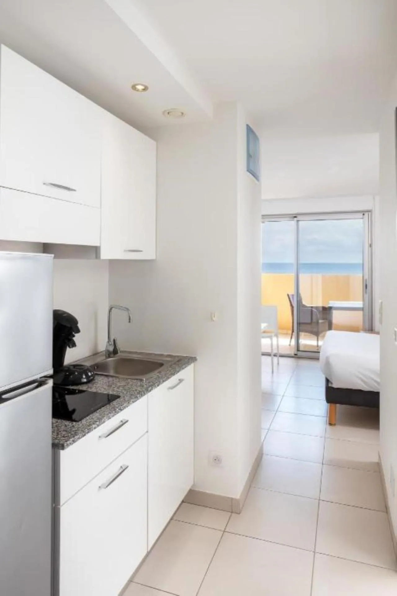 Kitchen or kitchenette, Bed in Résidence Marina Bianca