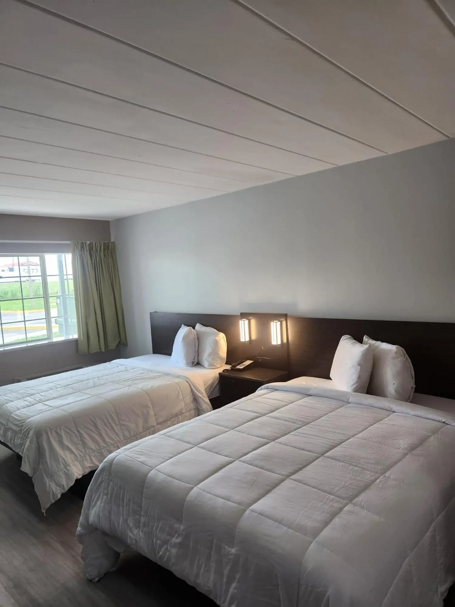 Bed in Royal Inn Hotel