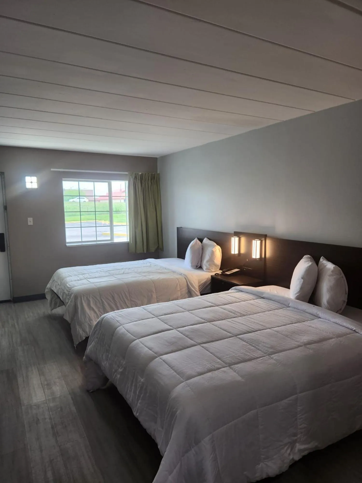 Bed in Royal Inn Hotel