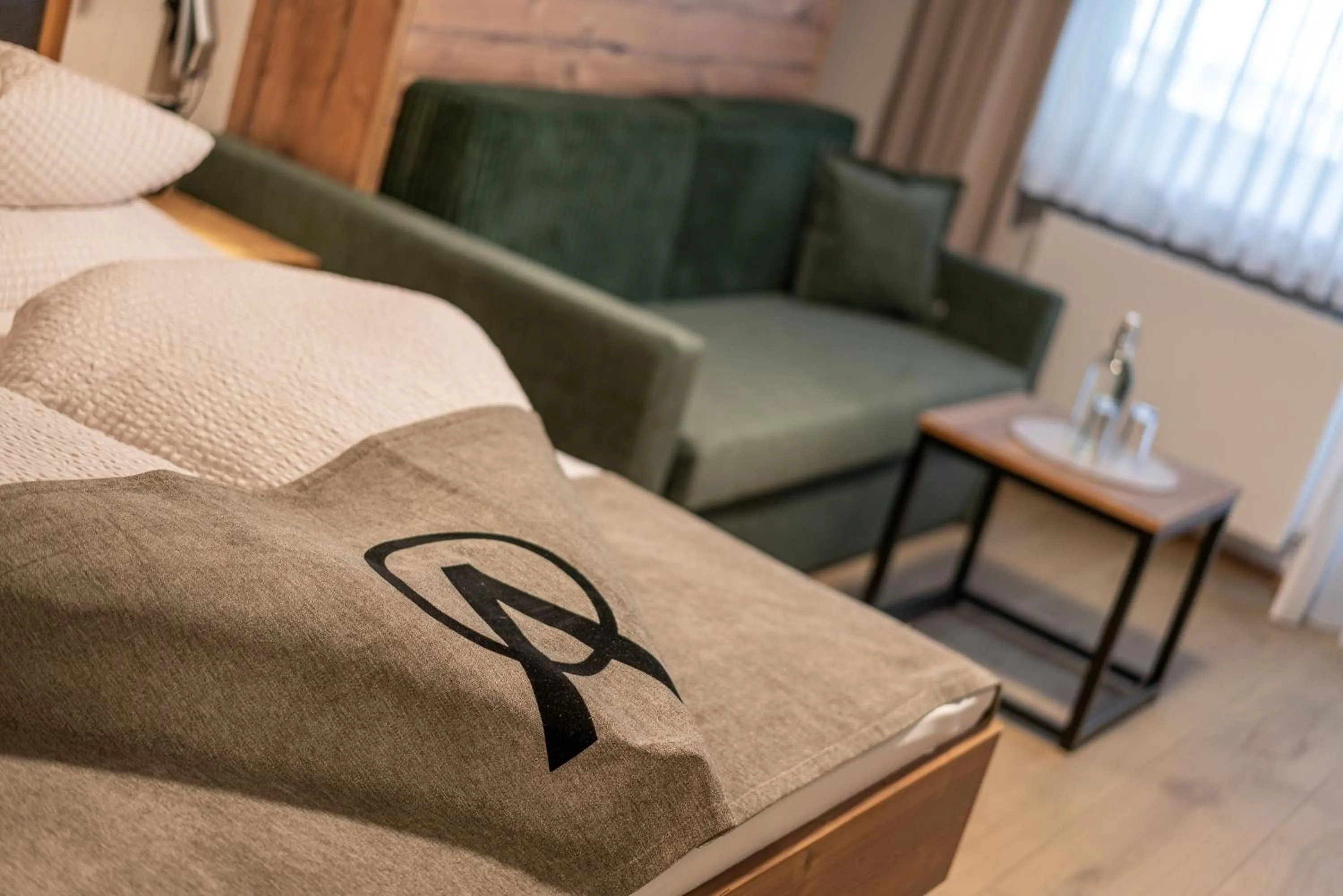 Seating area, Bed in Genusshotel Alpenblick