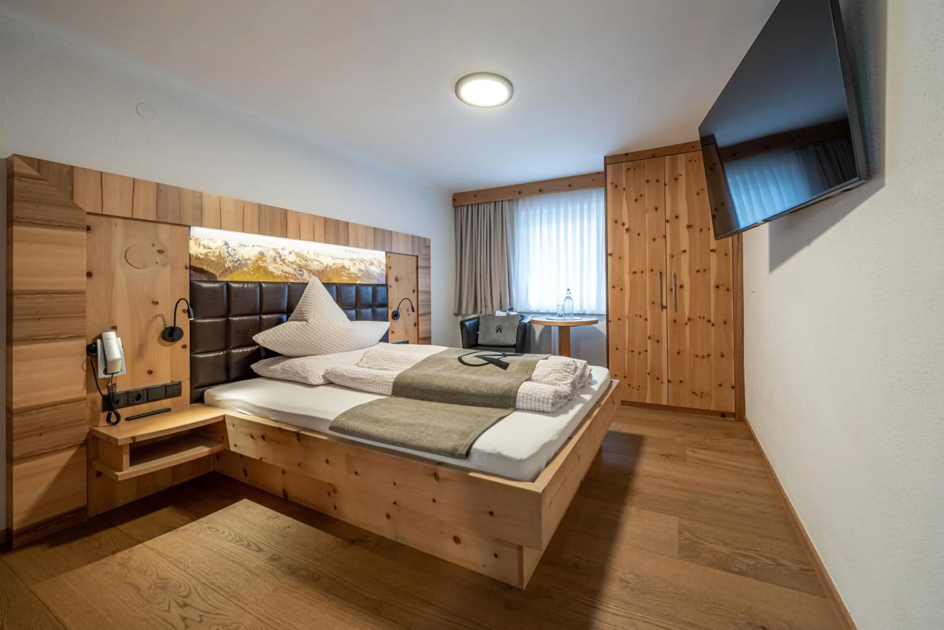 Photo of the whole room, Bed in Genusshotel Alpenblick