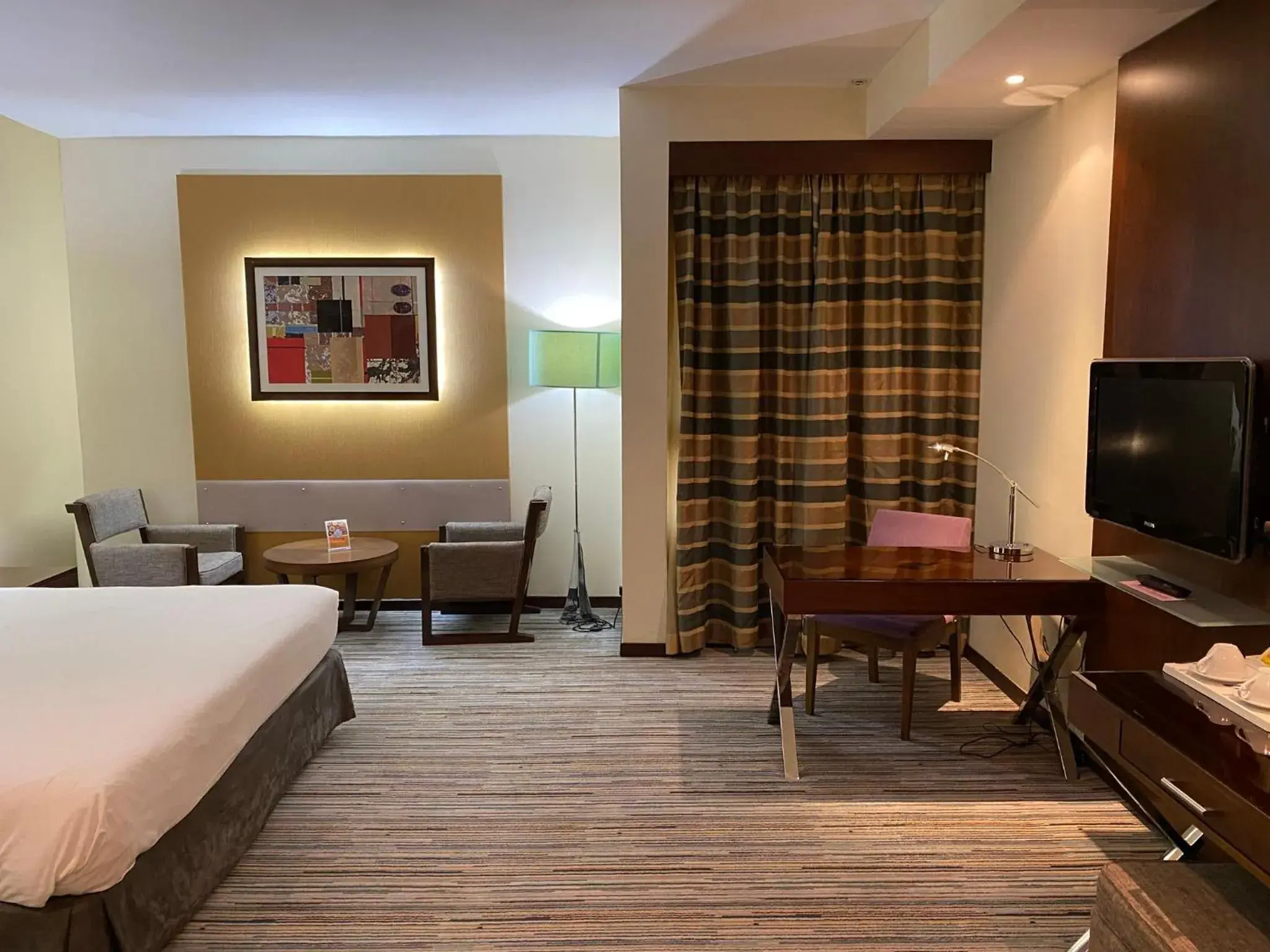 Seating area, Bed in Phoenix Plaza Hotel Apartments Seating area, Bed in Phoenix Plaza Hotel Apartments