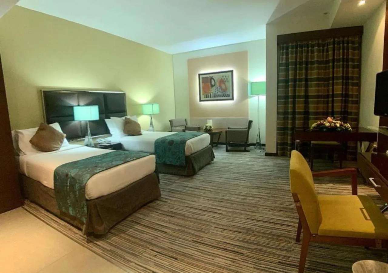 Bed in Phoenix Plaza Hotel Apartments