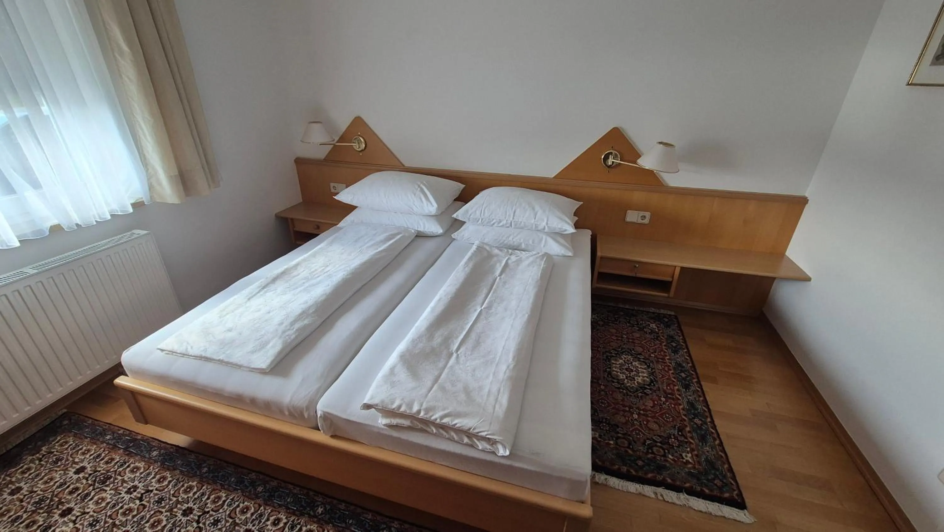 Bed in Haus Kraller-Urlaub mit Seeblick