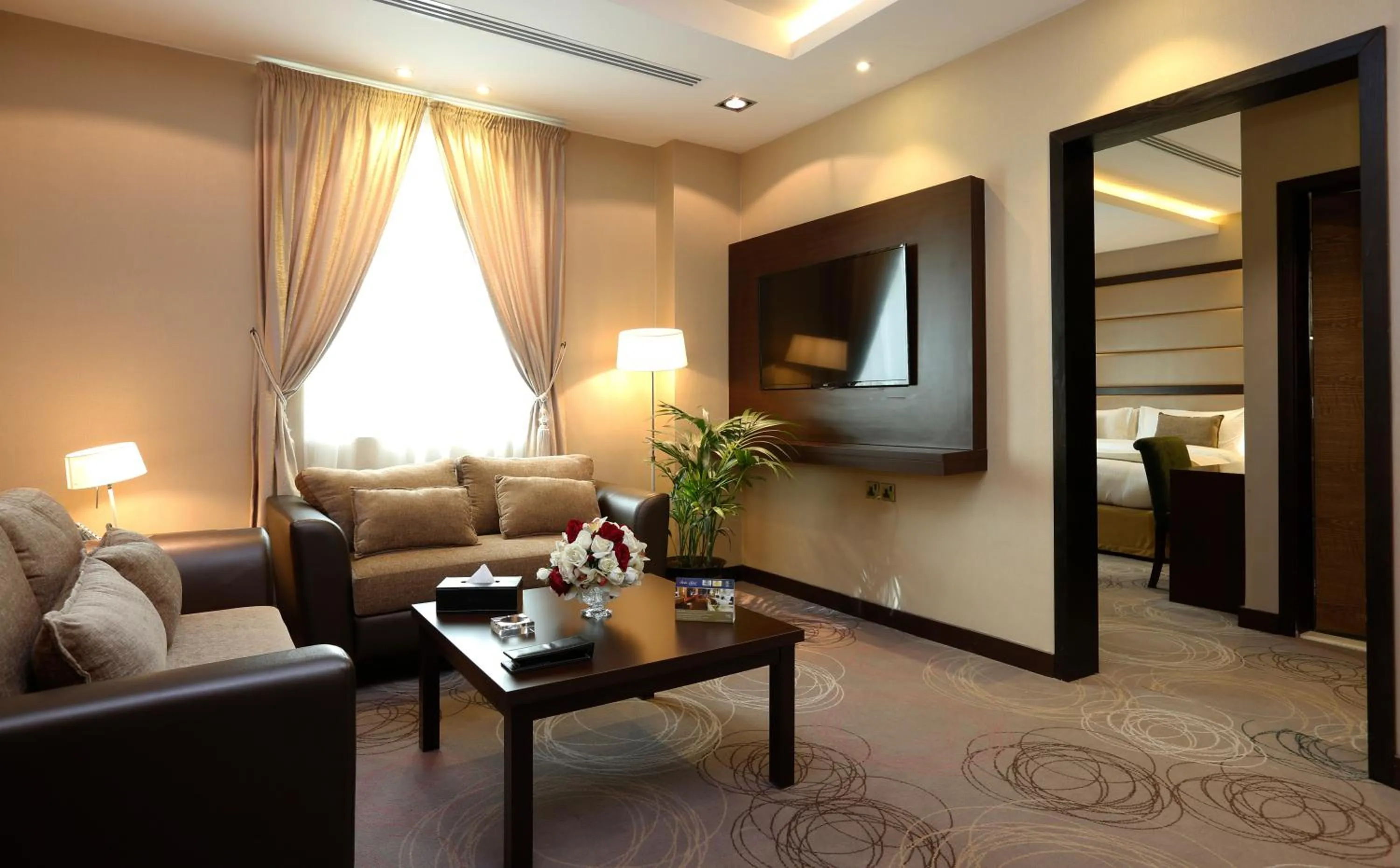 Communal lounge/ TV room in Swiss Flora Inn Hotel Riyadh