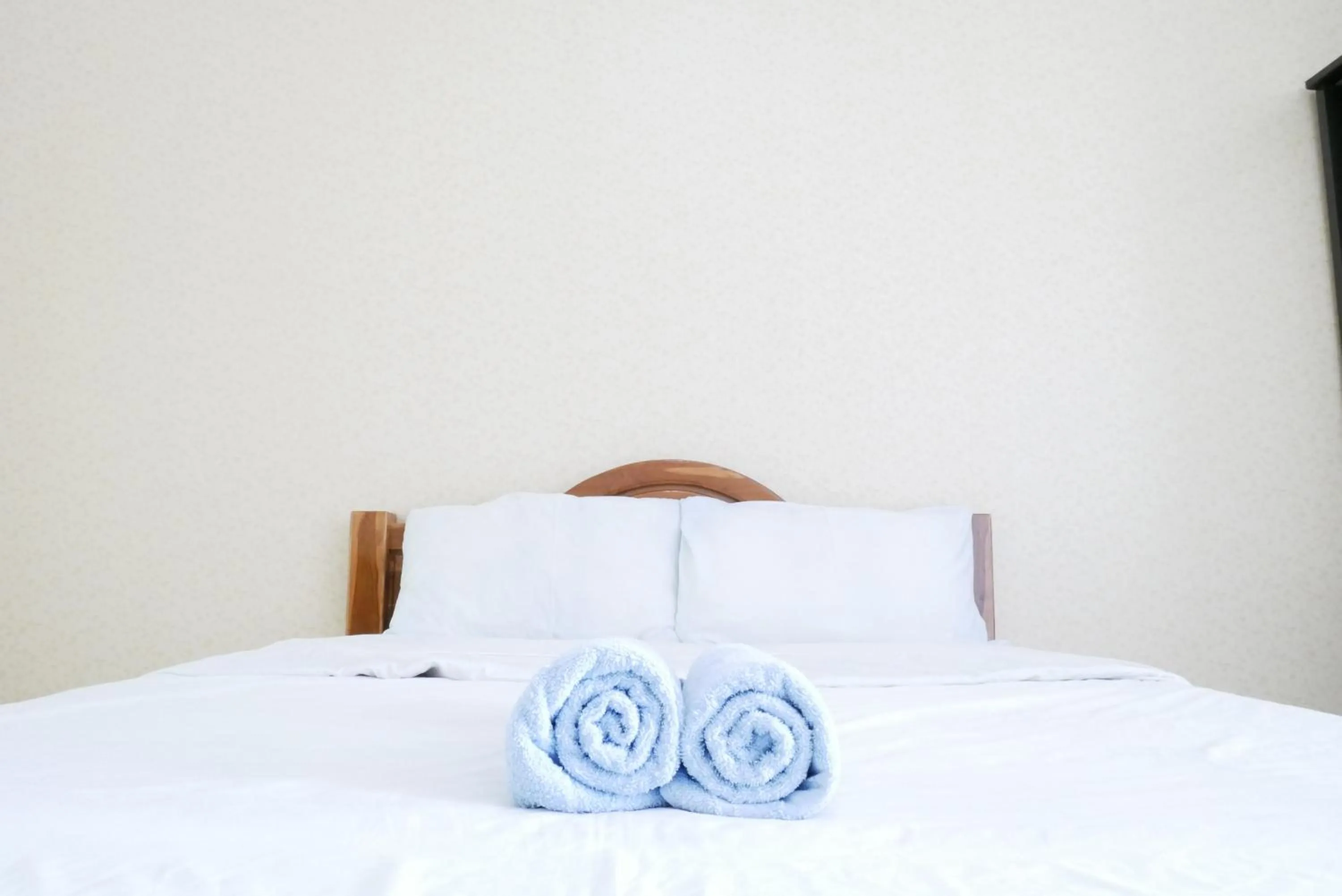 Bed in Fang Villa Hotel