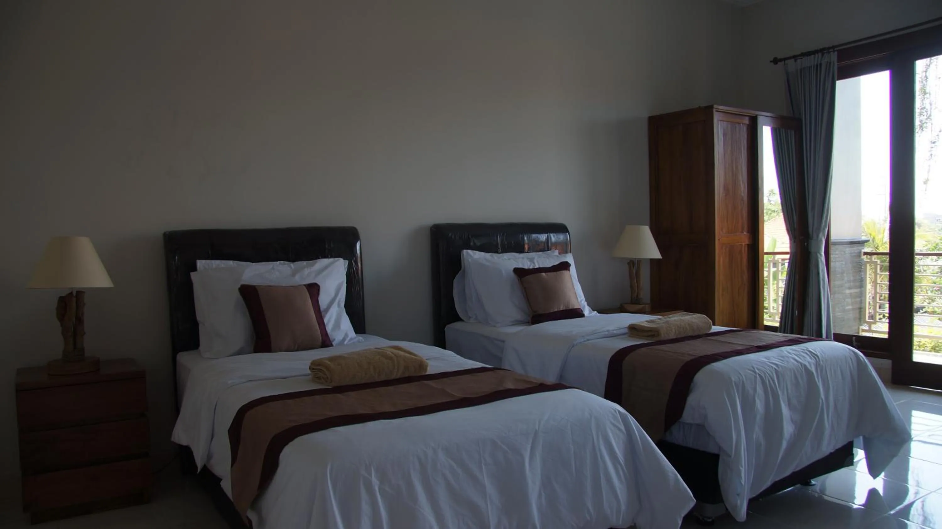 Bed in Surya Guest House Sanur