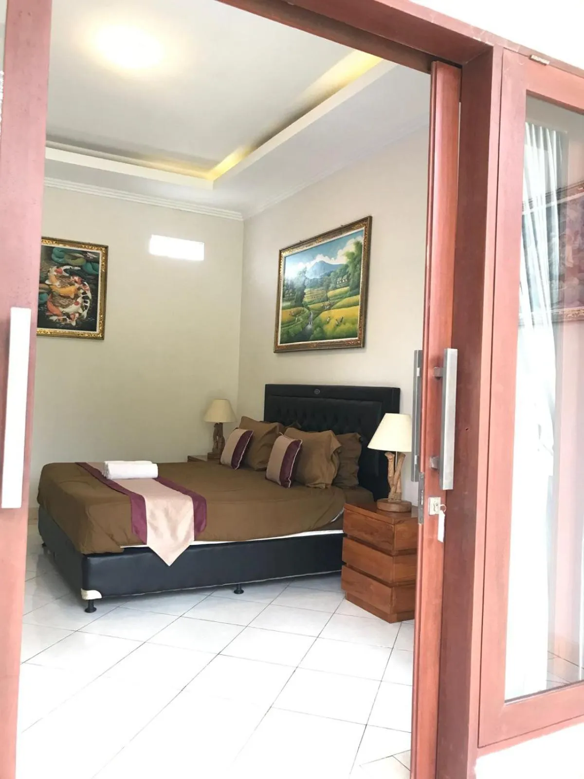 Bed in Surya Guest House Sanur