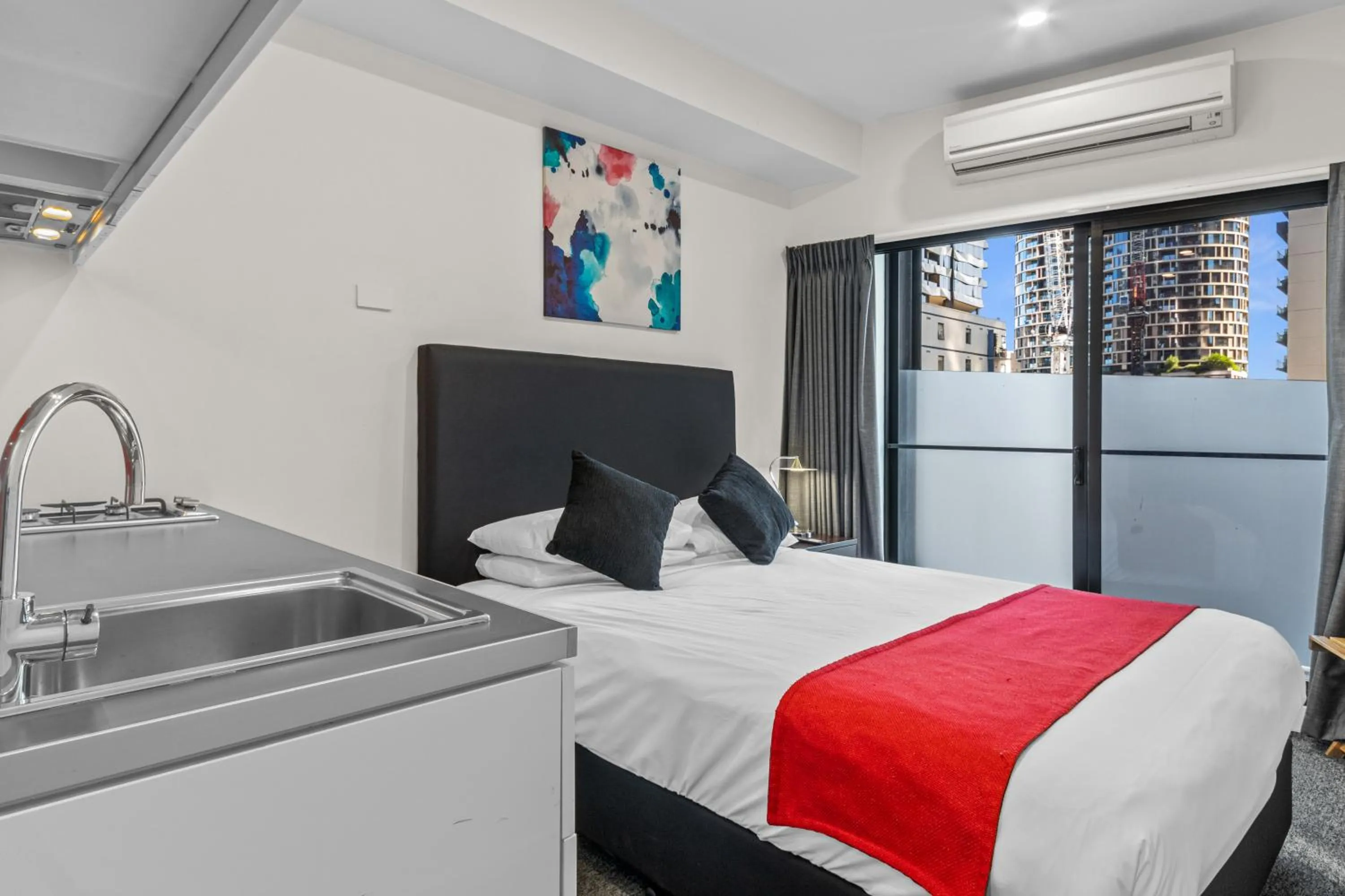 Bed in Comfort Apartments on Elizabeth