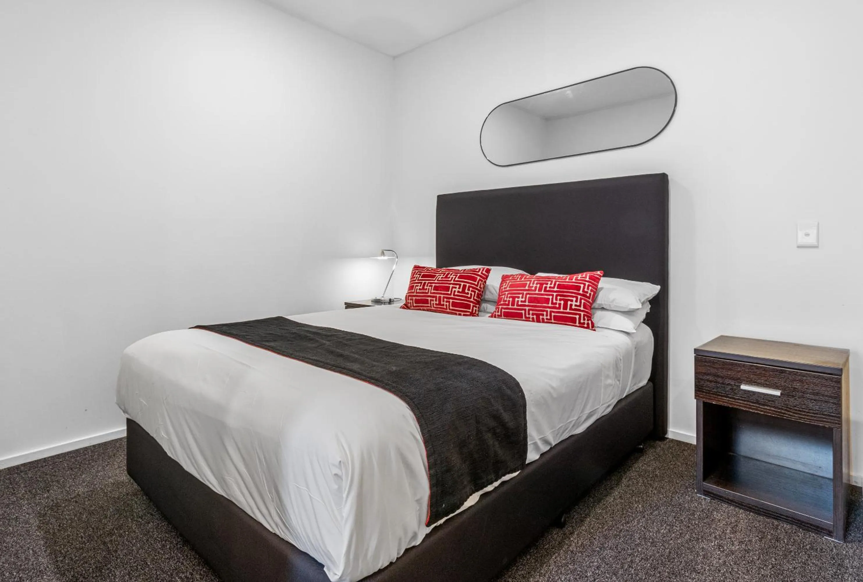 Bed in Comfort Apartments on Elizabeth