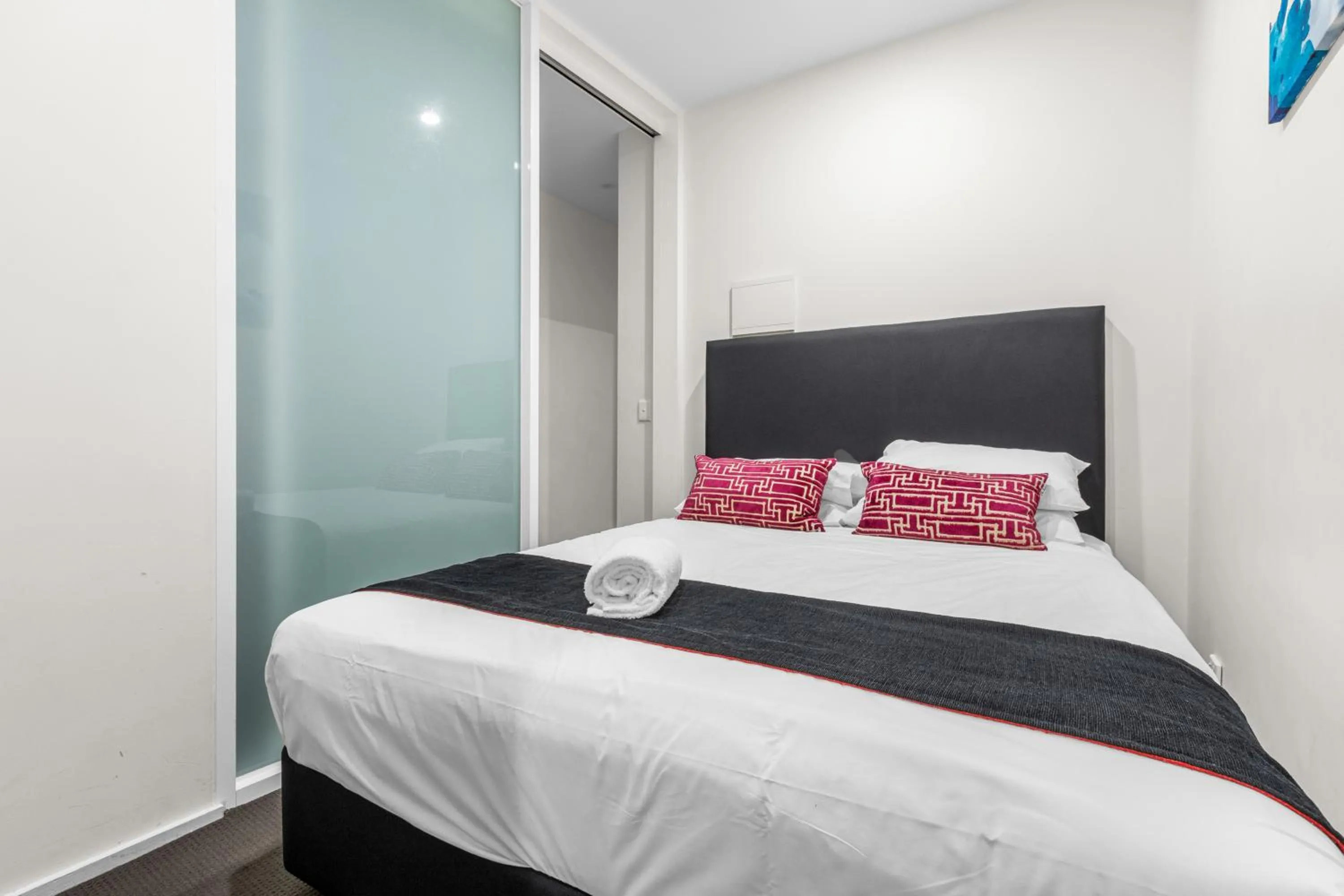 Bed in Comfort Apartments on Elizabeth