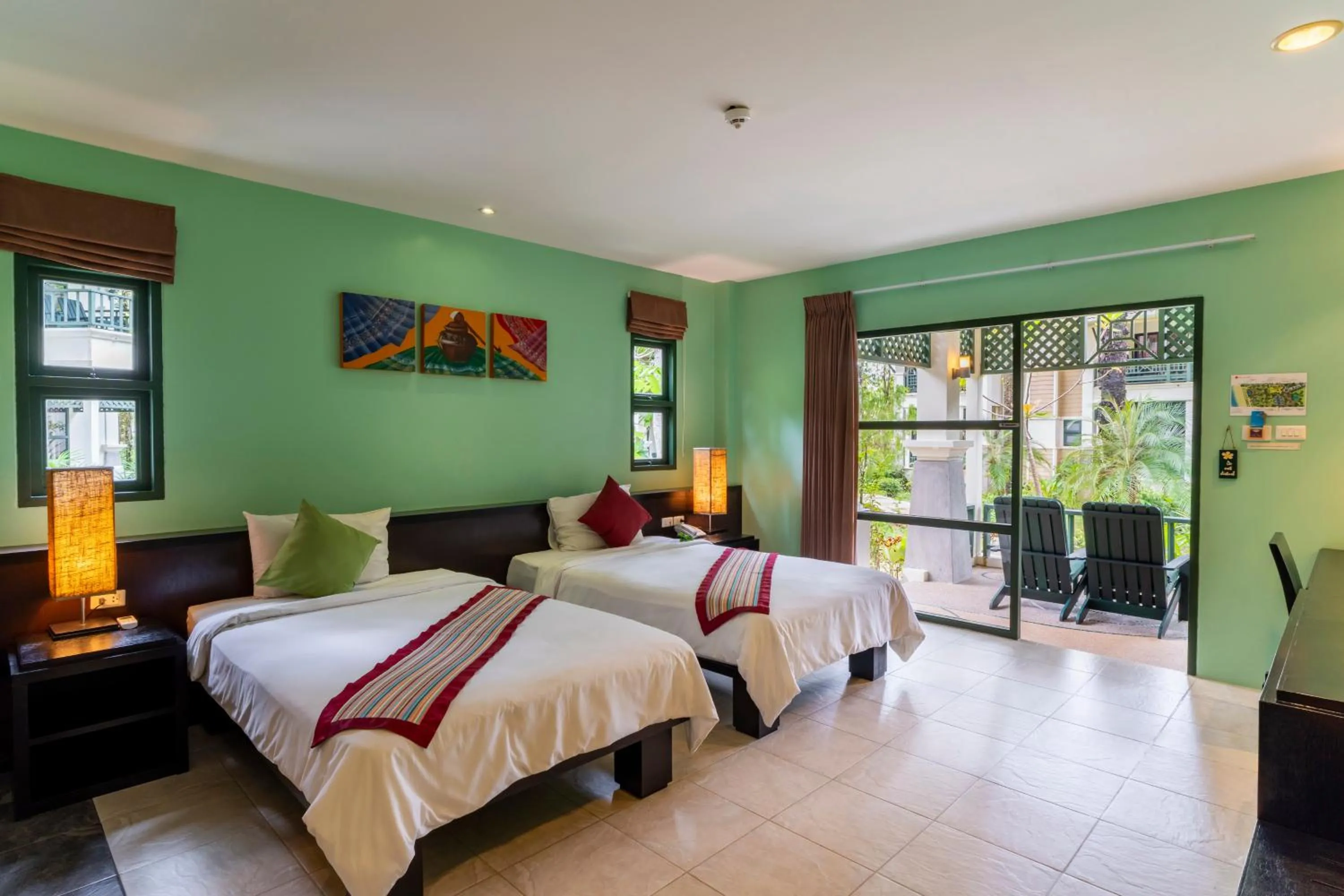 Bed in Baan Khaolak Beach Resort