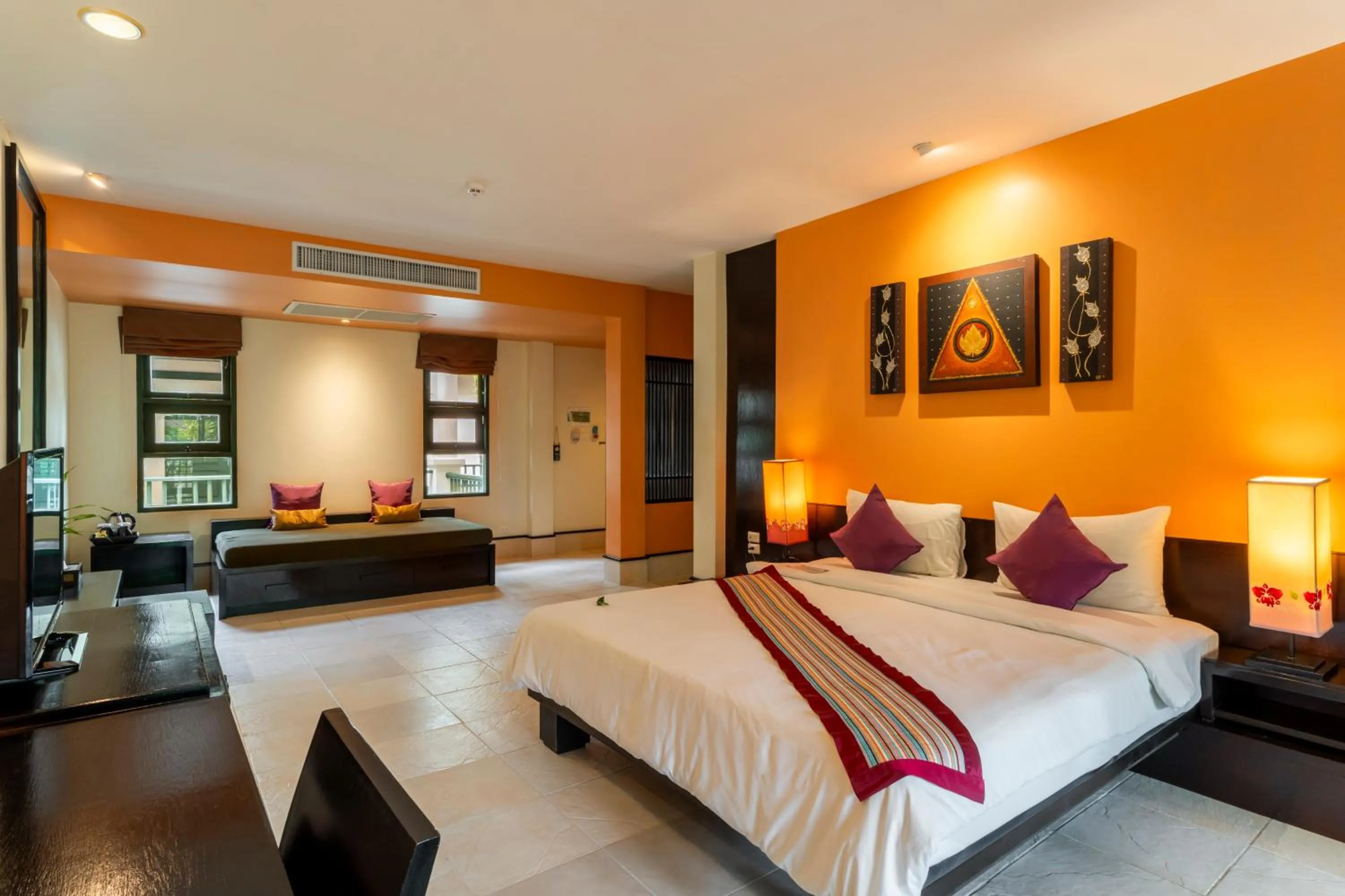 Bed in Baan Khaolak Beach Resort