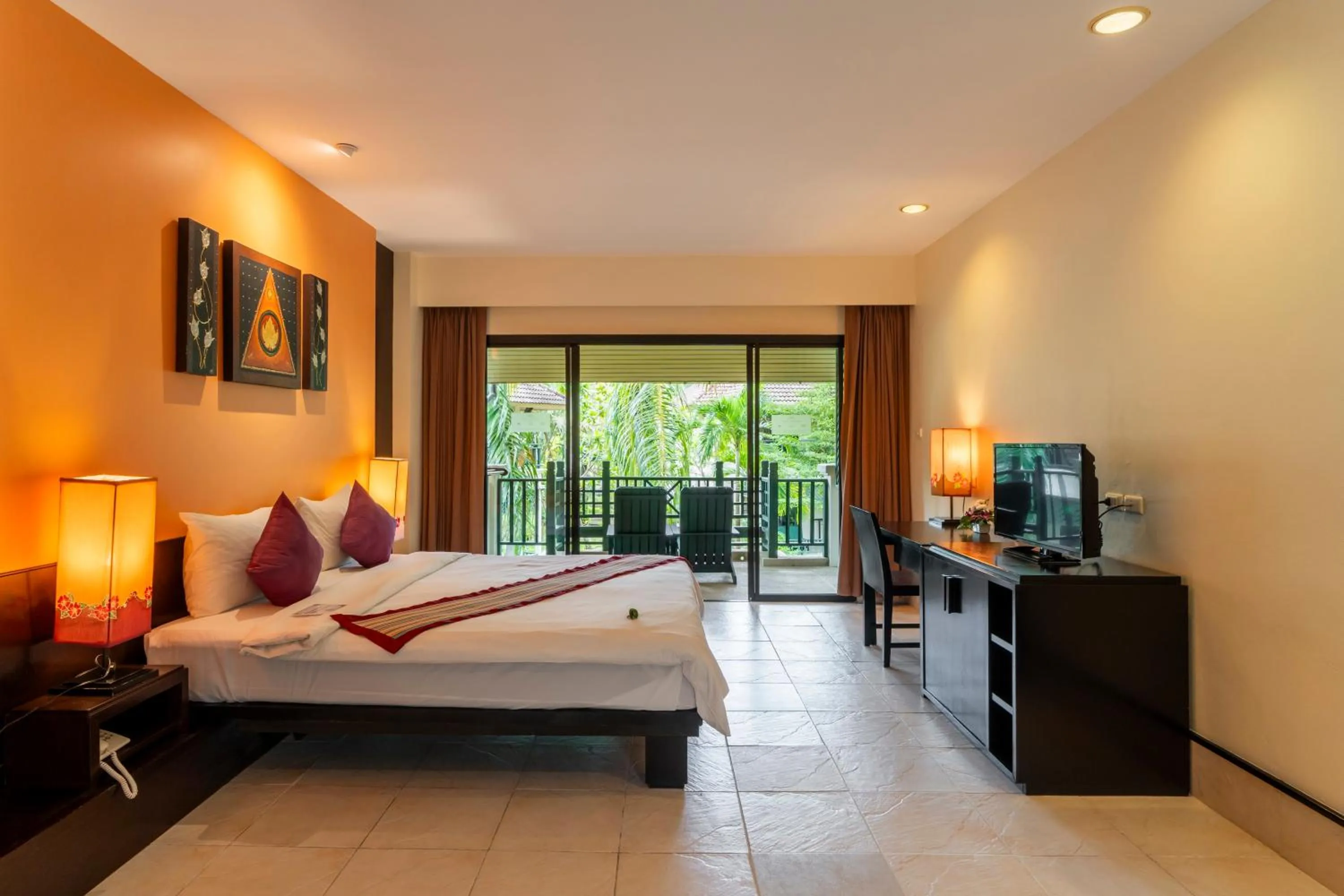 Bed in Baan Khaolak Beach Resort