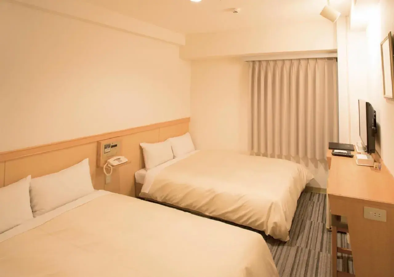 Bed in Toko City Hotel Matsumoto