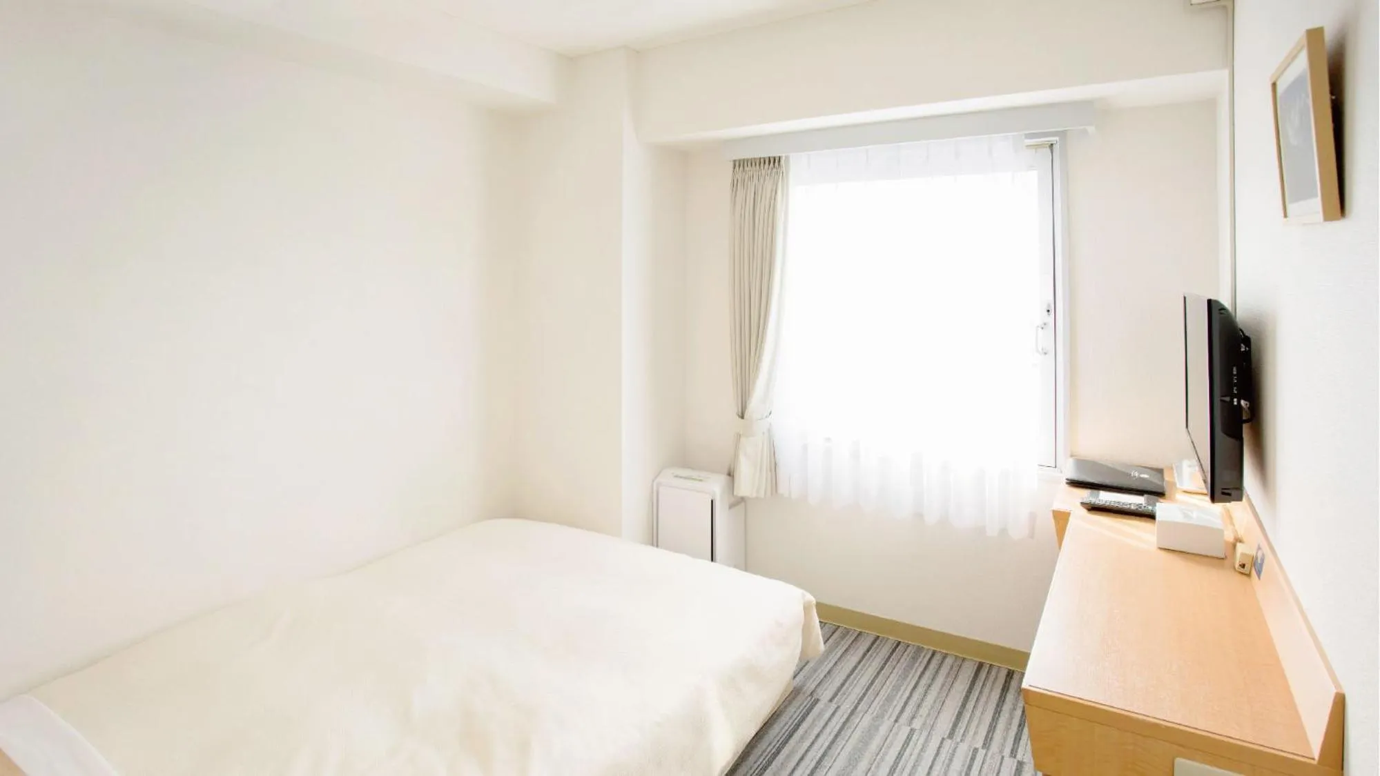 Bed in Toko City Hotel Matsumoto