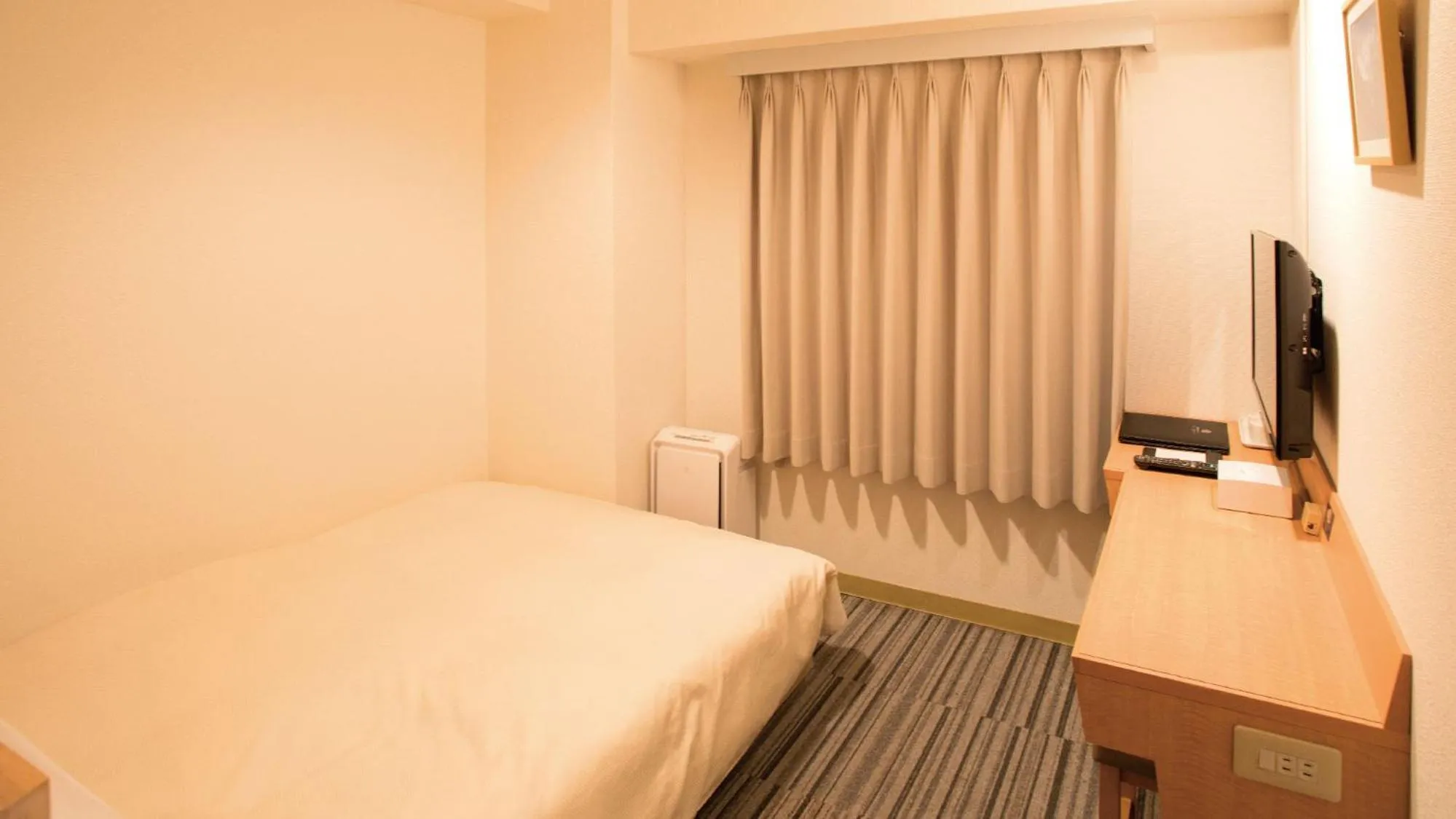 Bed in Toko City Hotel Matsumoto