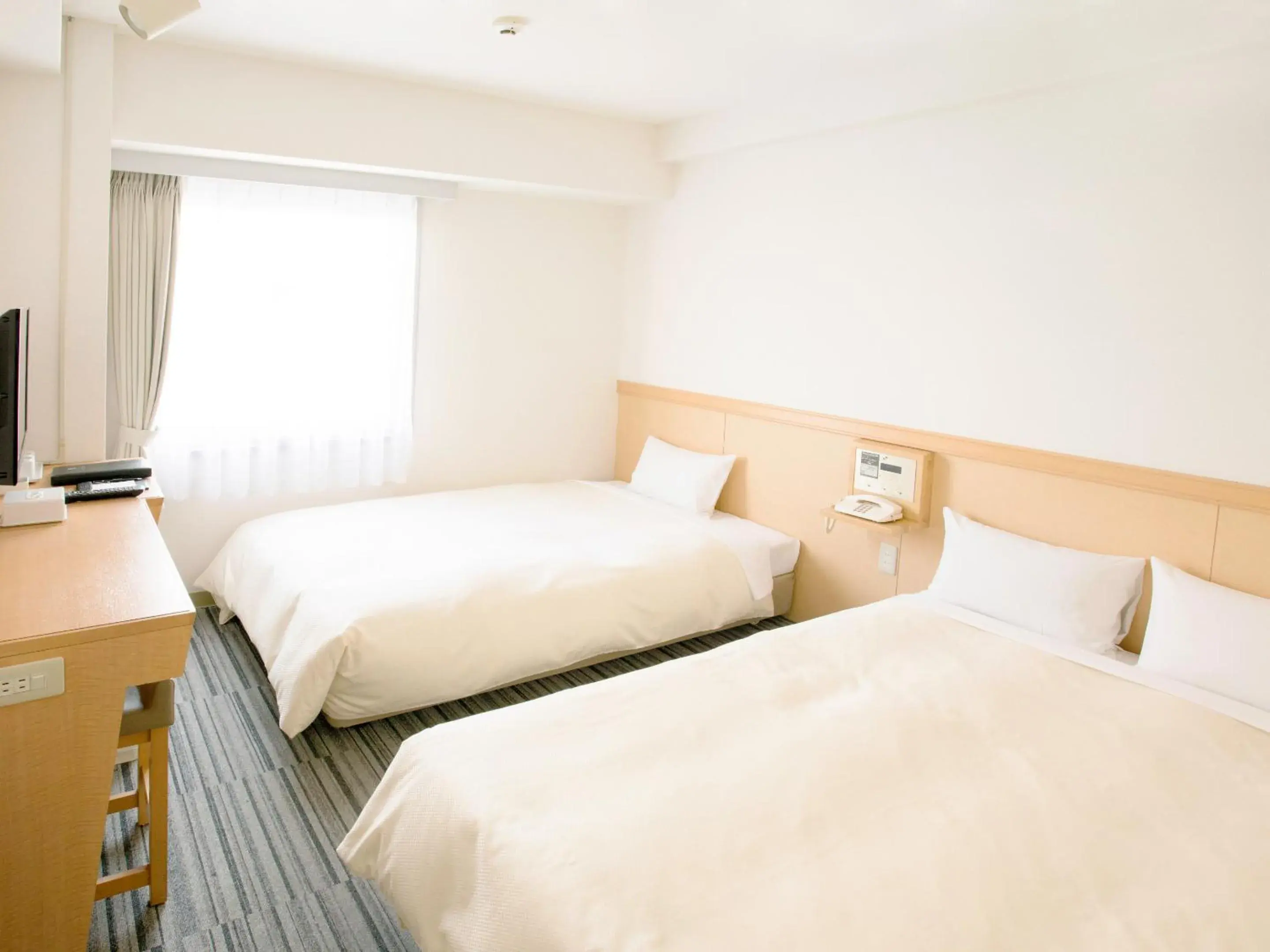 Bed in Toko City Hotel Matsumoto