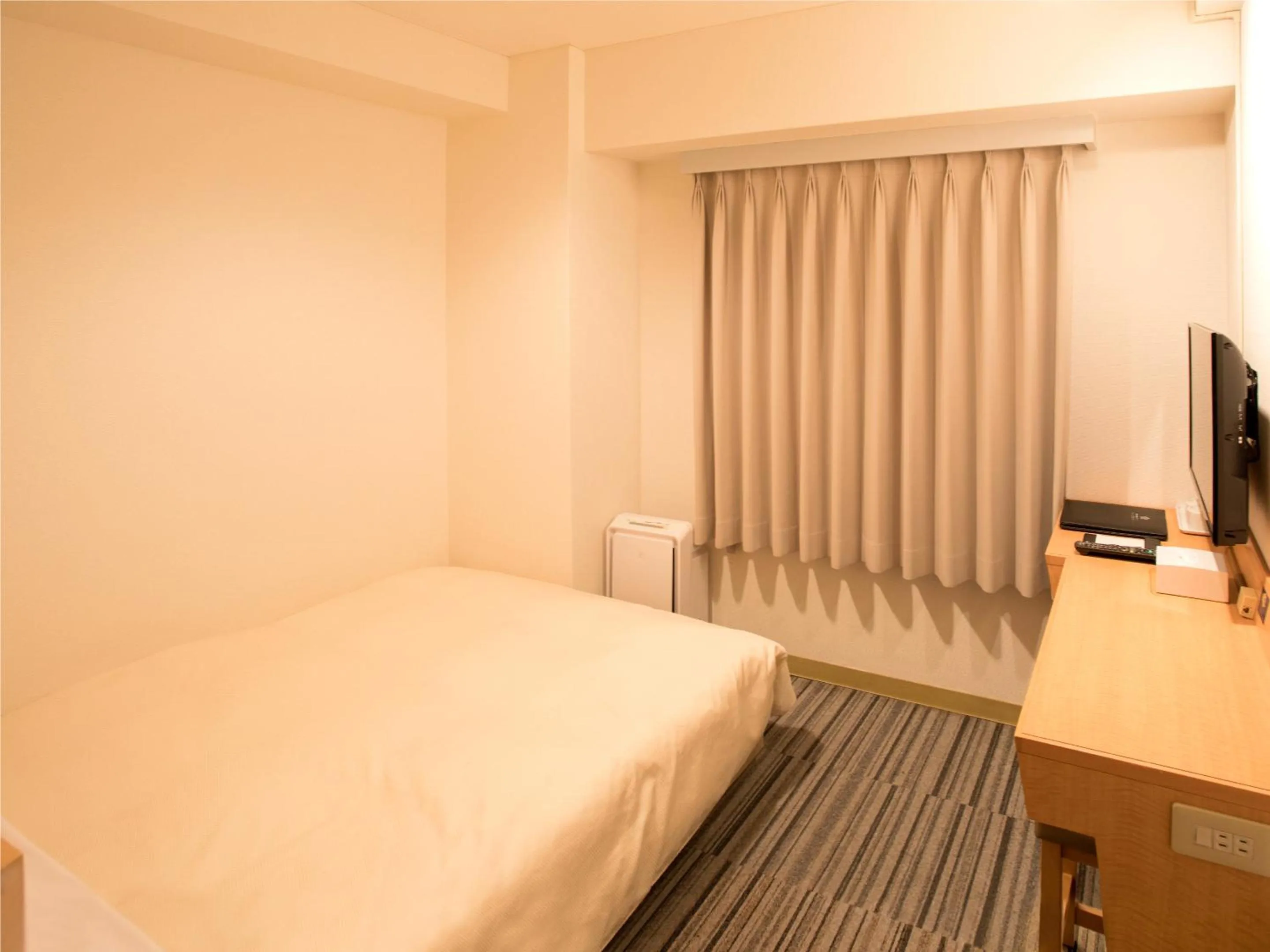 Bed in Toko City Hotel Matsumoto