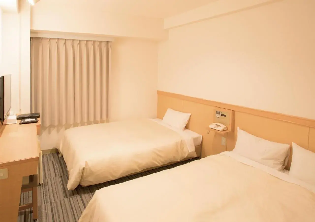 Bed in Toko City Hotel Matsumoto