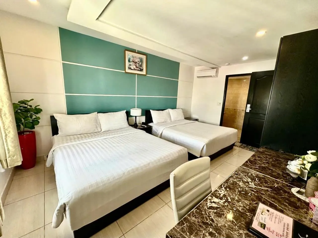 Bed in Sunrise Central Hotel