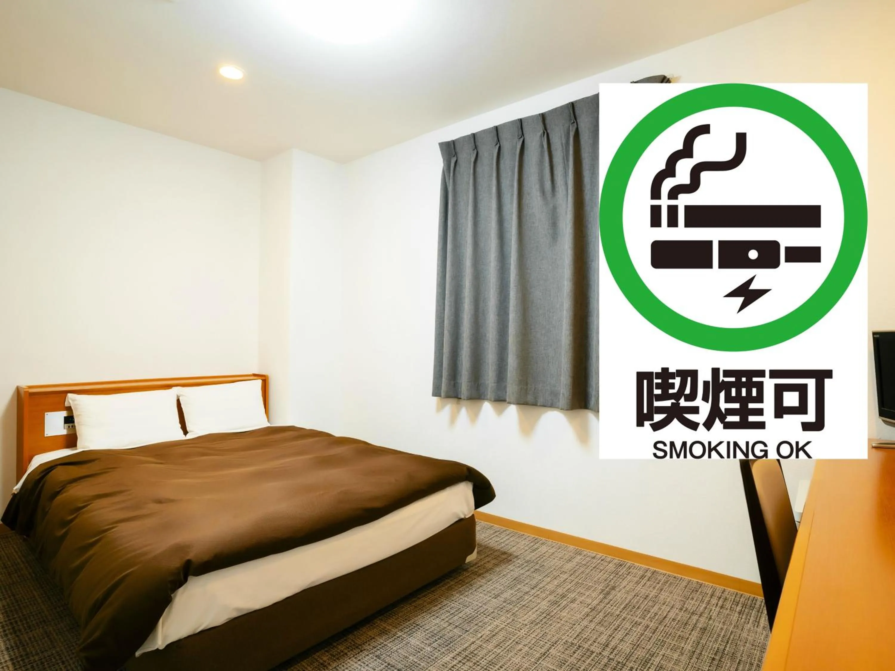 Bed in Kumamoto Ichibamae Business Kurenai Hotel