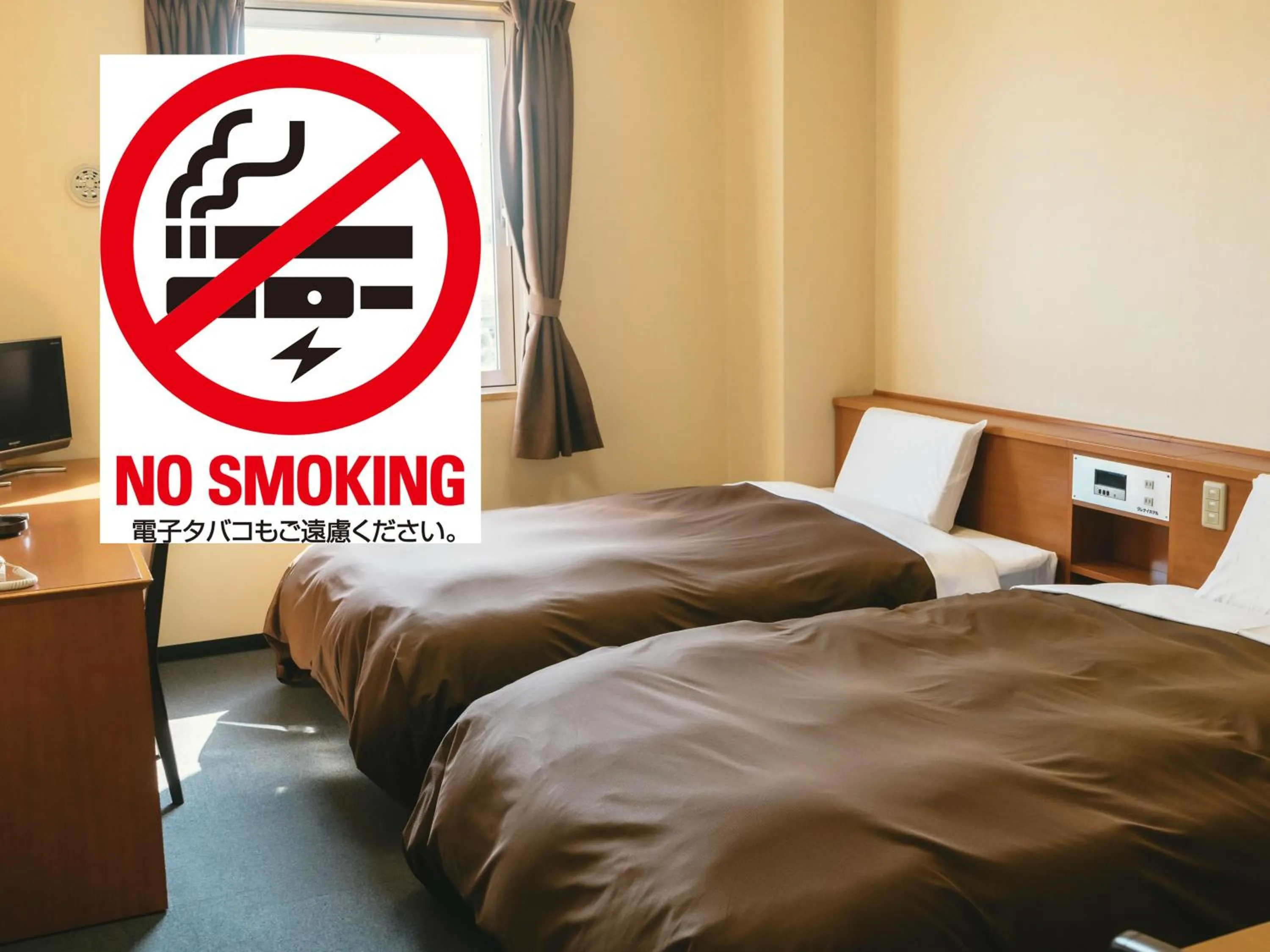 Bed in Kumamoto Ichibamae Business Kurenai Hotel