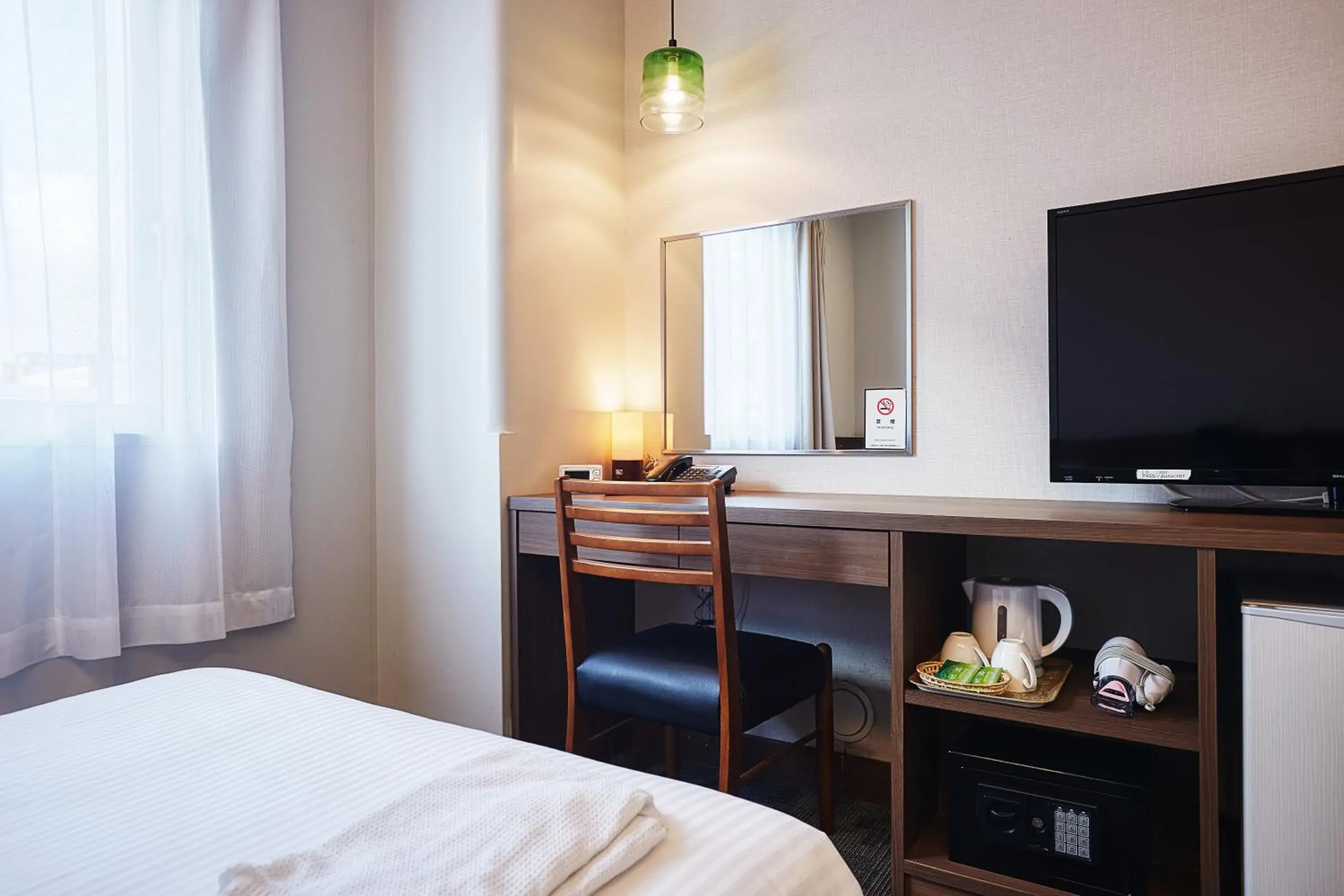 Bed in RJ Hotel Naha Bed in RJ Hotel Naha