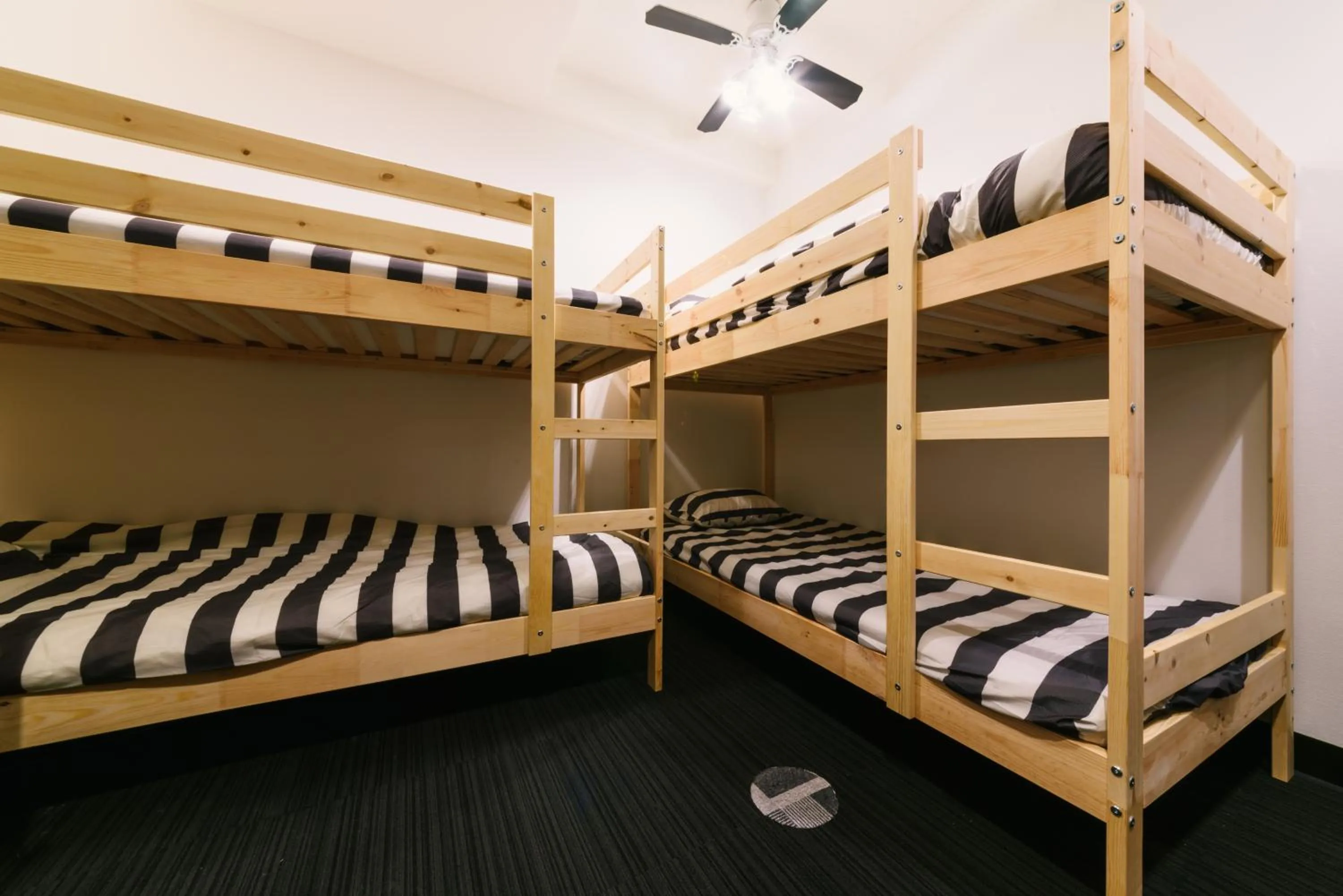 Bed in Guest House Yasuragi Hakataekimae