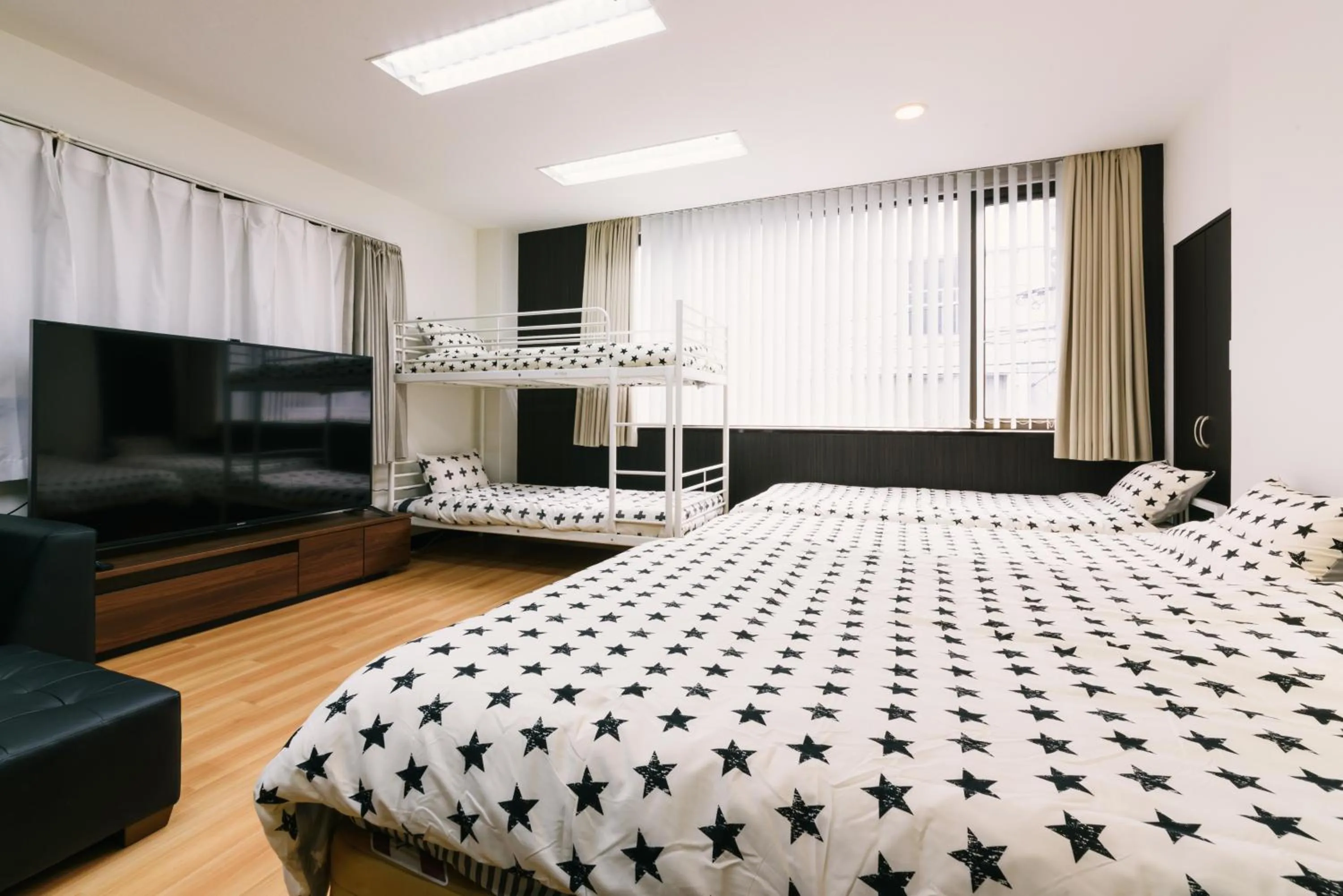 Bed in Guest House Yasuragi Hakataekimae