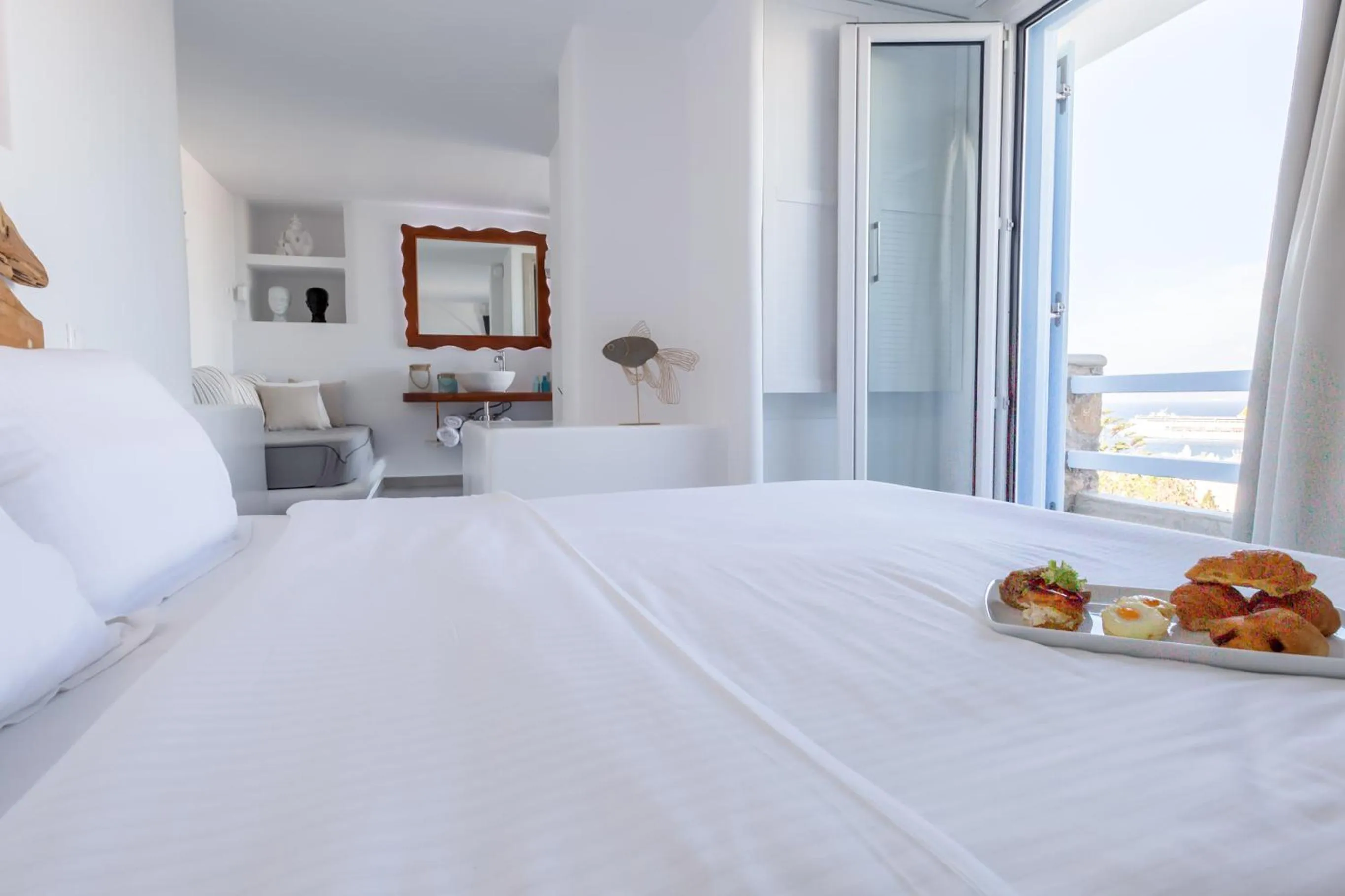 Photo of the whole room, Bed in Ibiscus Boutique