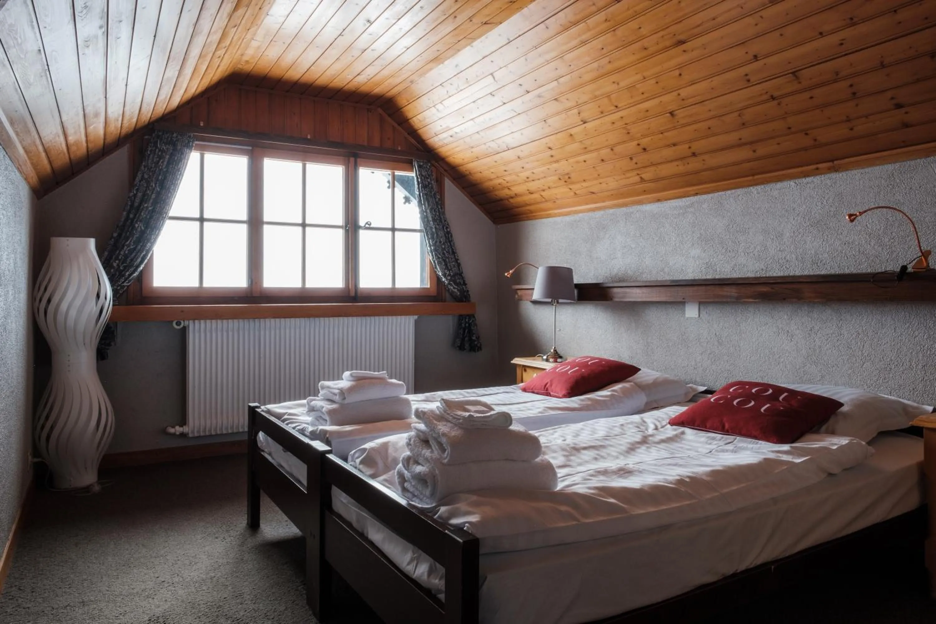 Bed in Le Coucou Hotel Restaurant & Lounge-Bar