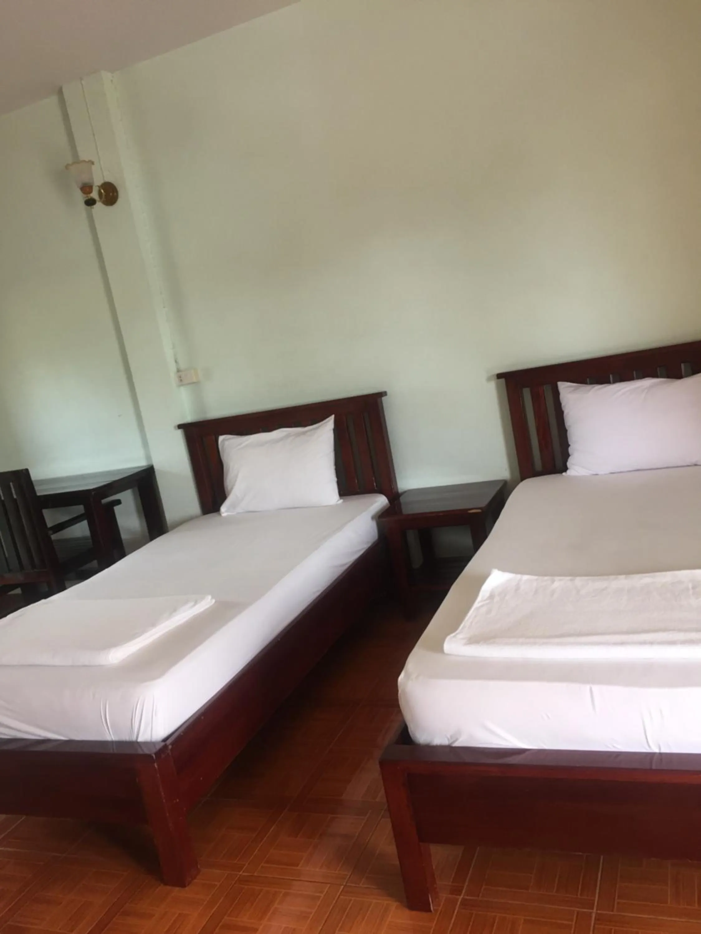 Bed in Poon Suk Hotel Kabin Buri
