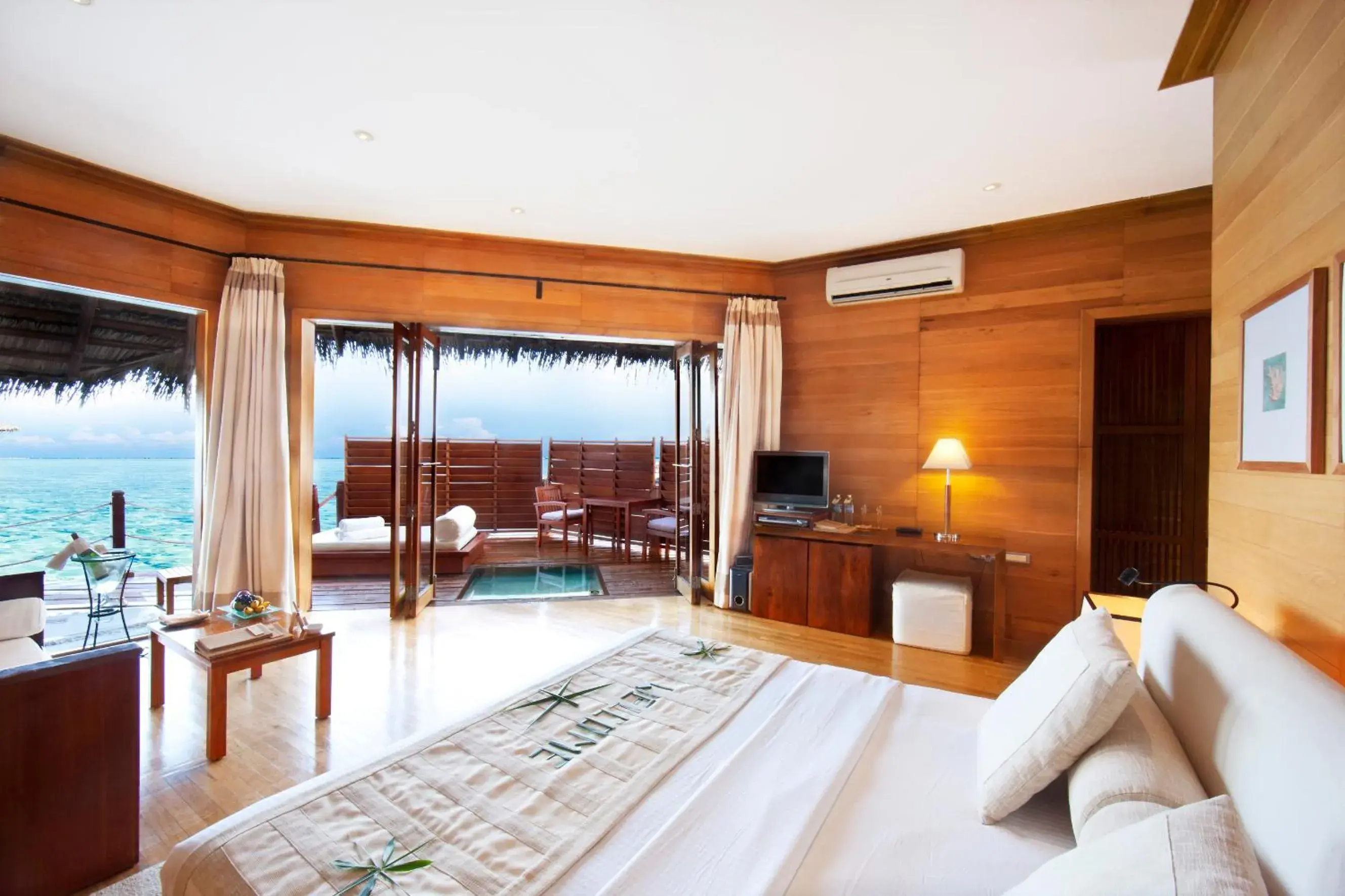 Photo of the whole room, Bed in Adaaran Prestige Water Villas - with Dine around Premium All inclusive - 24 hours Photo of the whole room, Bed in Adaaran Prestige Water Villas - with Dine around Premium All inclusive - 24 hours