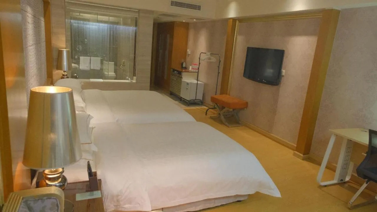 Communal lounge/ TV room, Bed in Guangzhou Good International Hotel