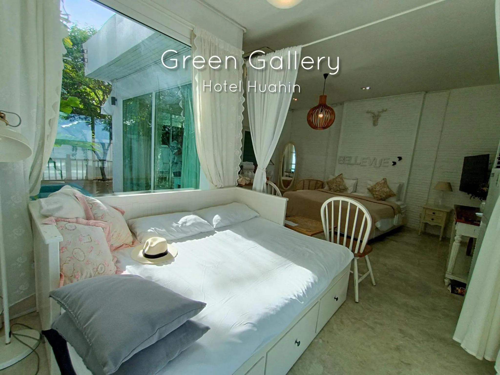 Bed in Green Gallery Beach Boutique Hotel