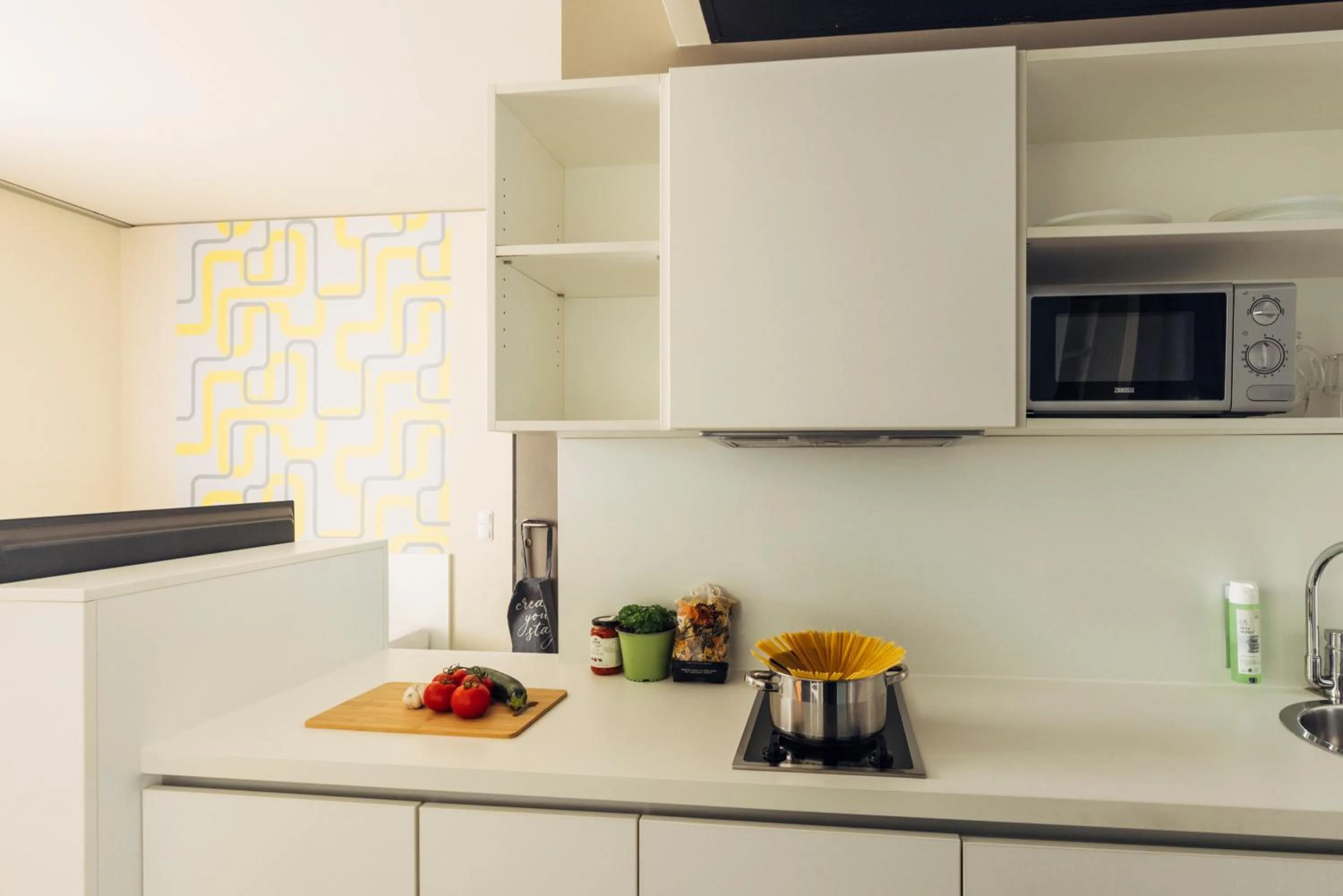 Kitchen or kitchenette in harry's home Dornbirn hotel & apartments