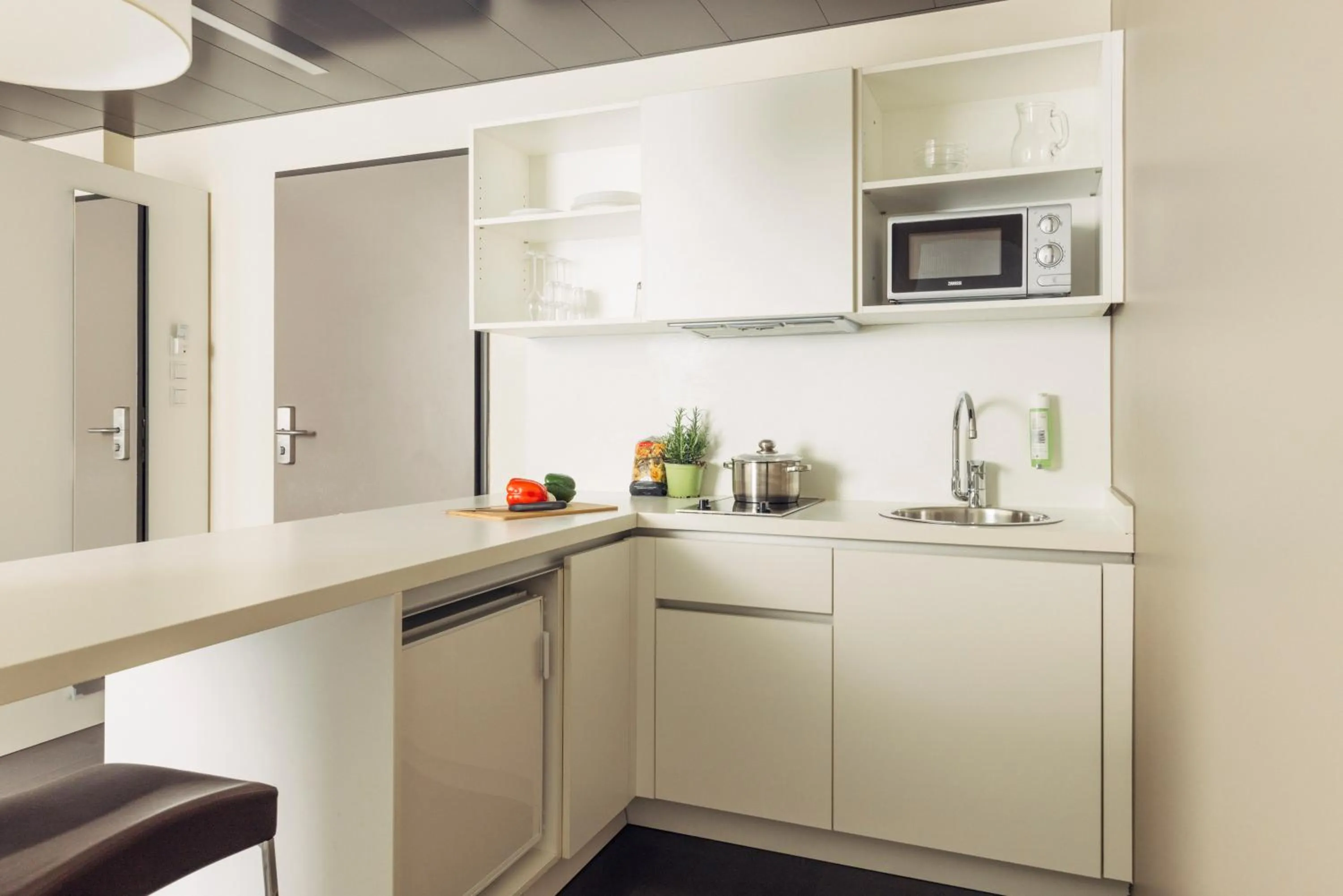 Kitchen or kitchenette in harry's home Dornbirn hotel & apartments